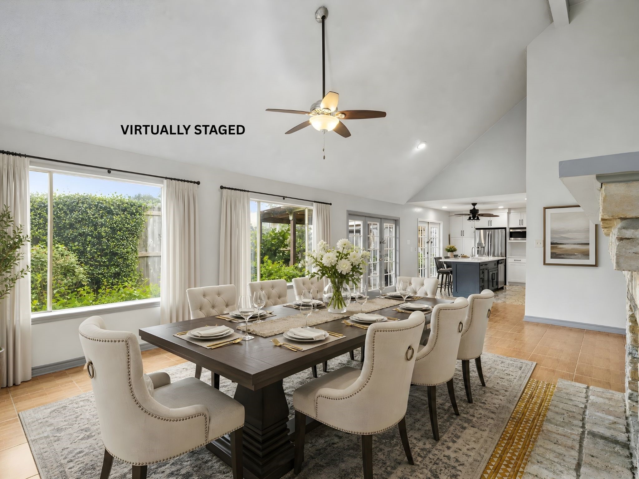 The virtually staged dining area, showcasing how a large table comfortably seats family and friends for everyday meals and special gatherings alike.