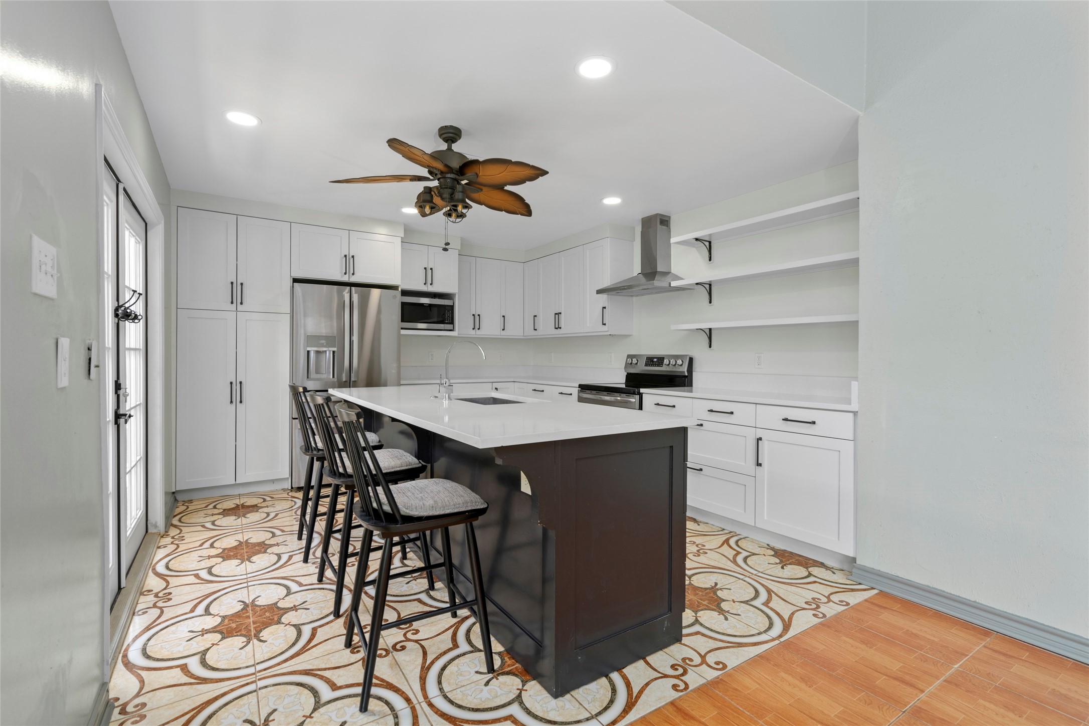 Another angle of the kitchen island, highlighting the generous counter space ideal for meal prep and entertaining. Another angle of the kitchen island, highlighting the generous counter space ideal for meal prep and entertaining.
