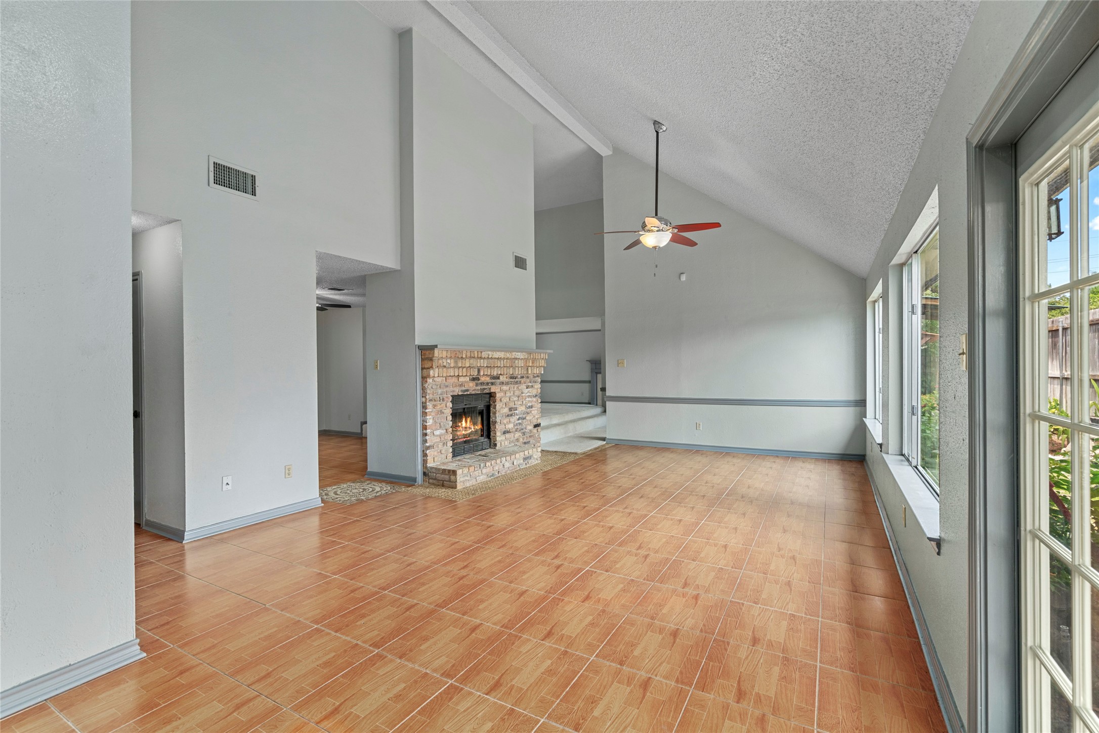 A wide shot of the open dining area, showing off the flexible floor plan and abundance of natural light pouring through the windows. A wide shot of the open dining area, showing off the flexible floor plan and abundance of natural light pouring through the windows.