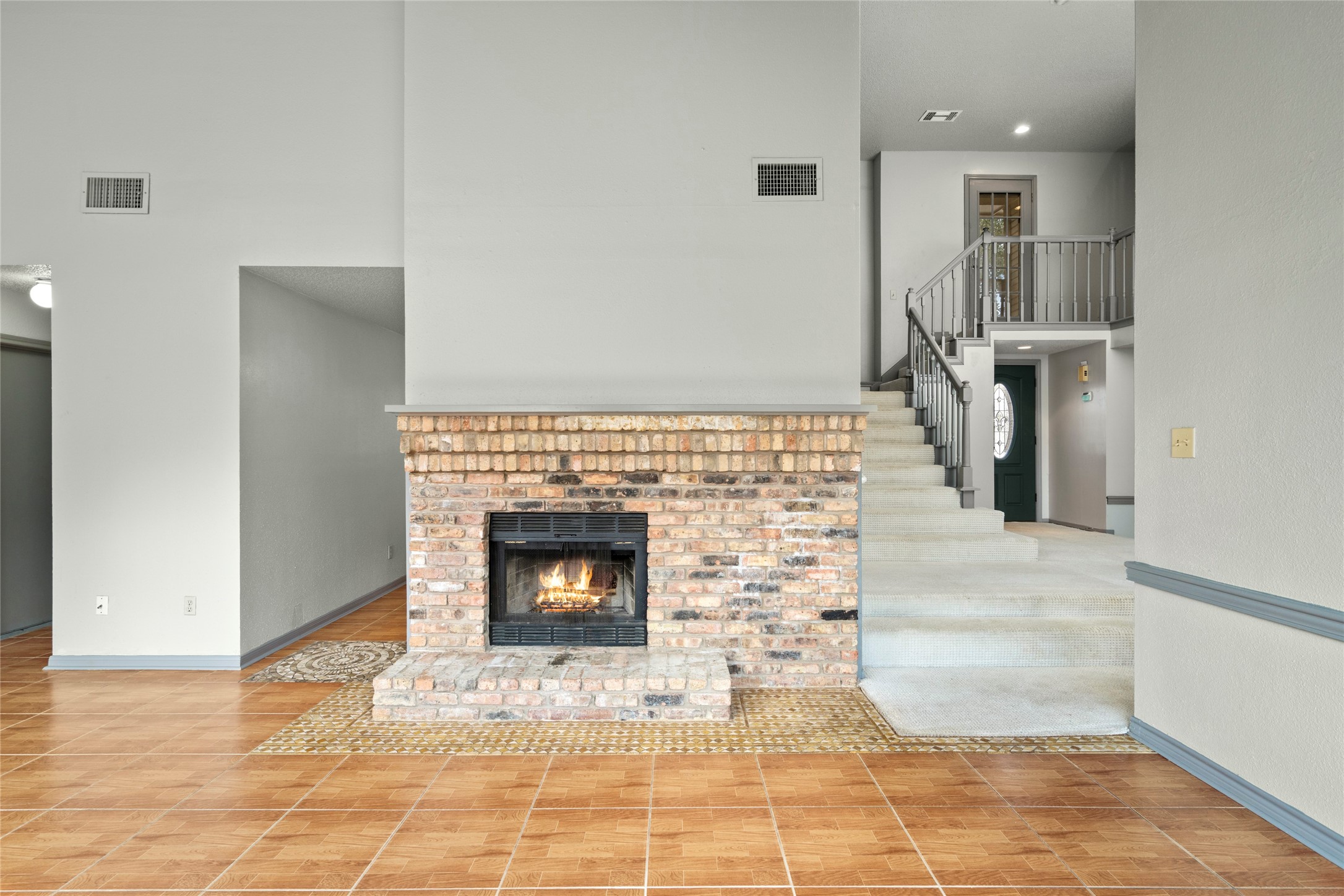 Another look at the fireside living space, emphasizing the warmth and character the fireplace brings to daily living. Another look at the fireside living space, emphasizing the warmth and character the fireplace brings to daily living.