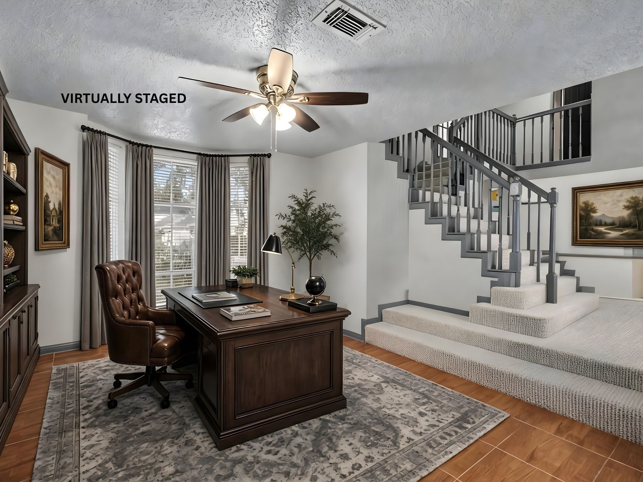 The virtually staged home office, located just to the right upon entry  a perfect, private space to work from home without sacrificing convenience.