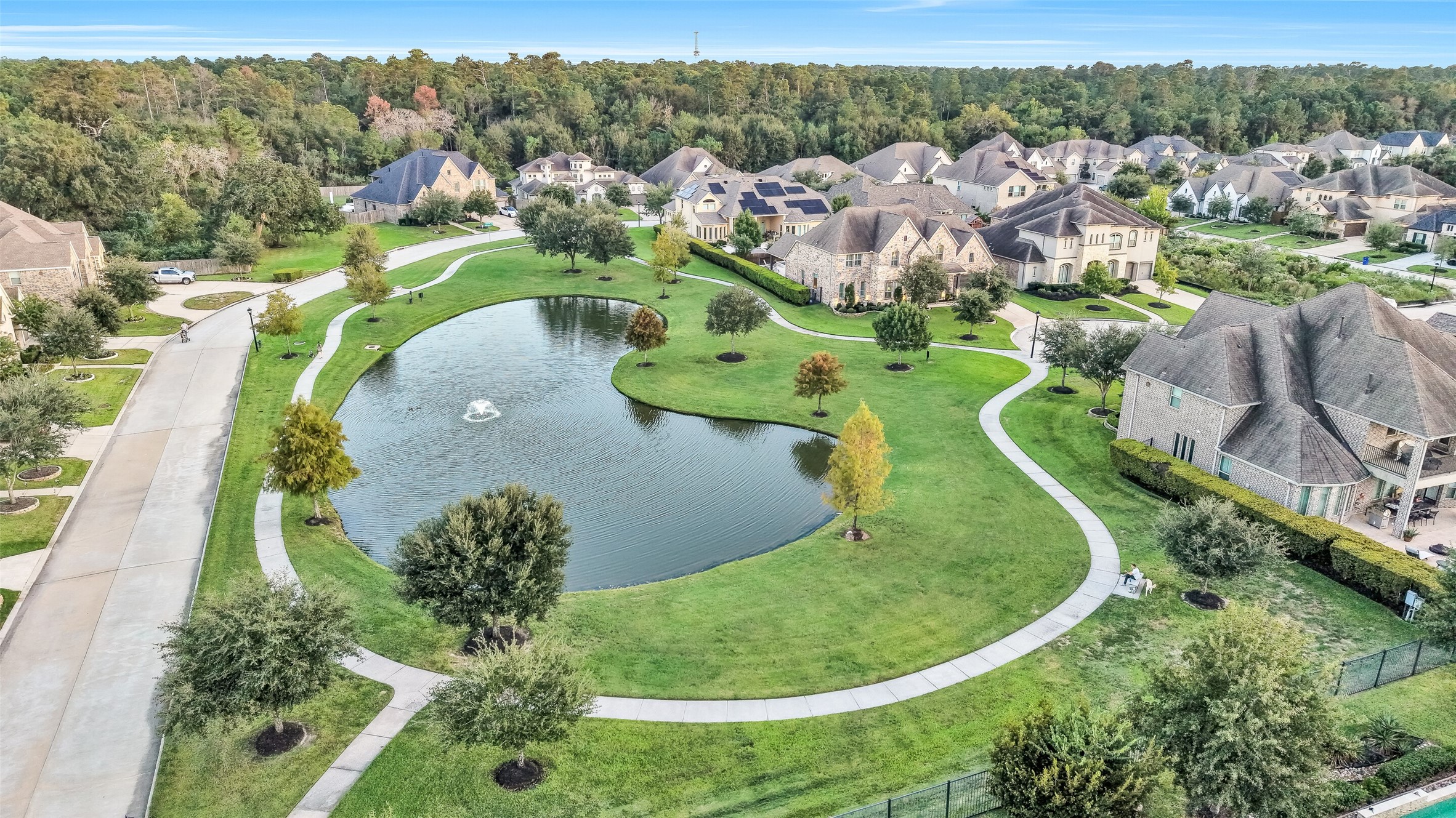 Just steps from the home is the neighborhood pond and paved walking trail. With no visible power lines and backing a forest, this peaceful community is a pleasure to come home to. Just steps from the home is the neighborhood pond and paved walking trail. With no visible power lines and backing a forest, this peaceful community is a pleasure to come home to.