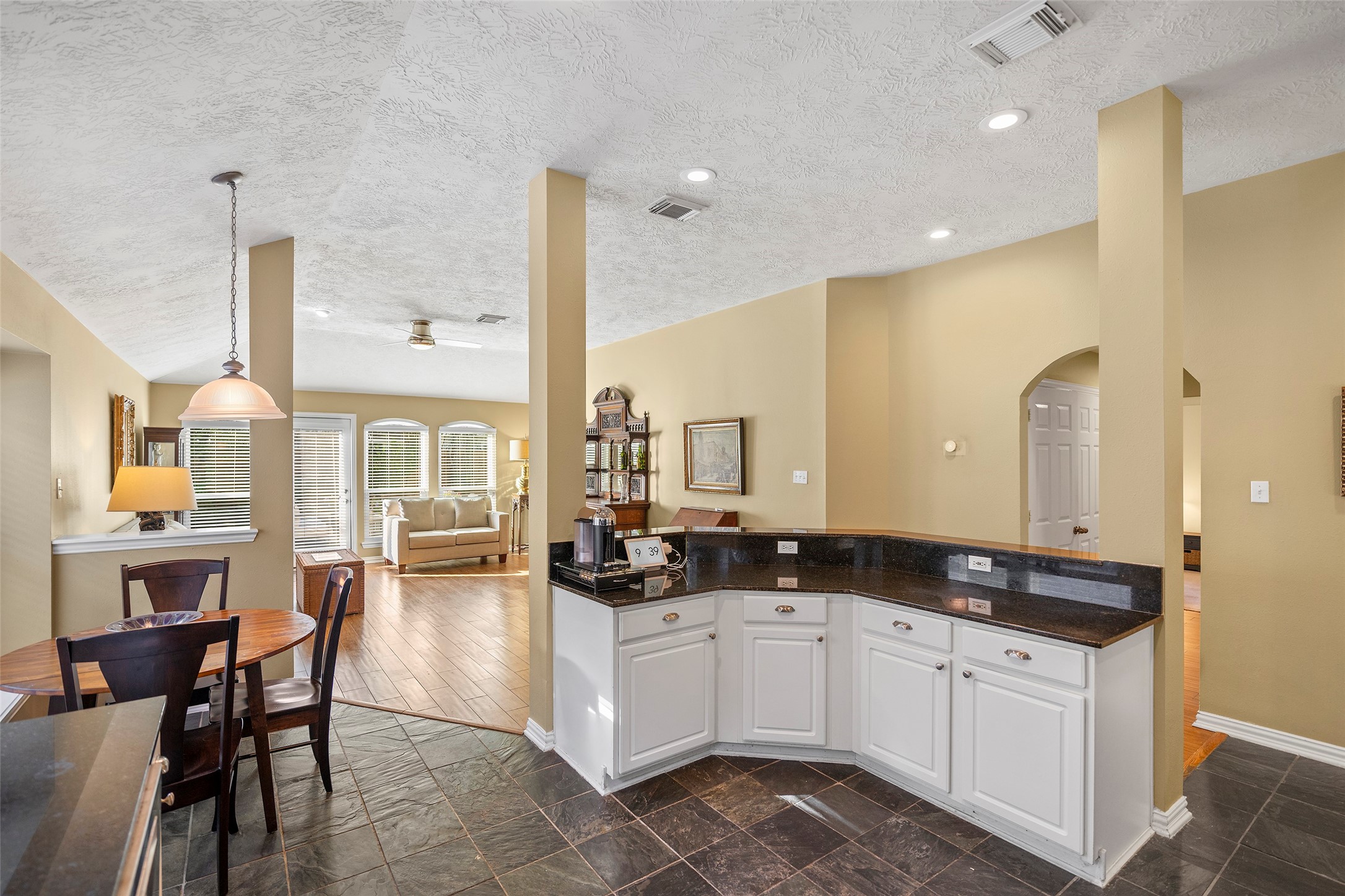 This view shows the open floor plan and access to the living room.