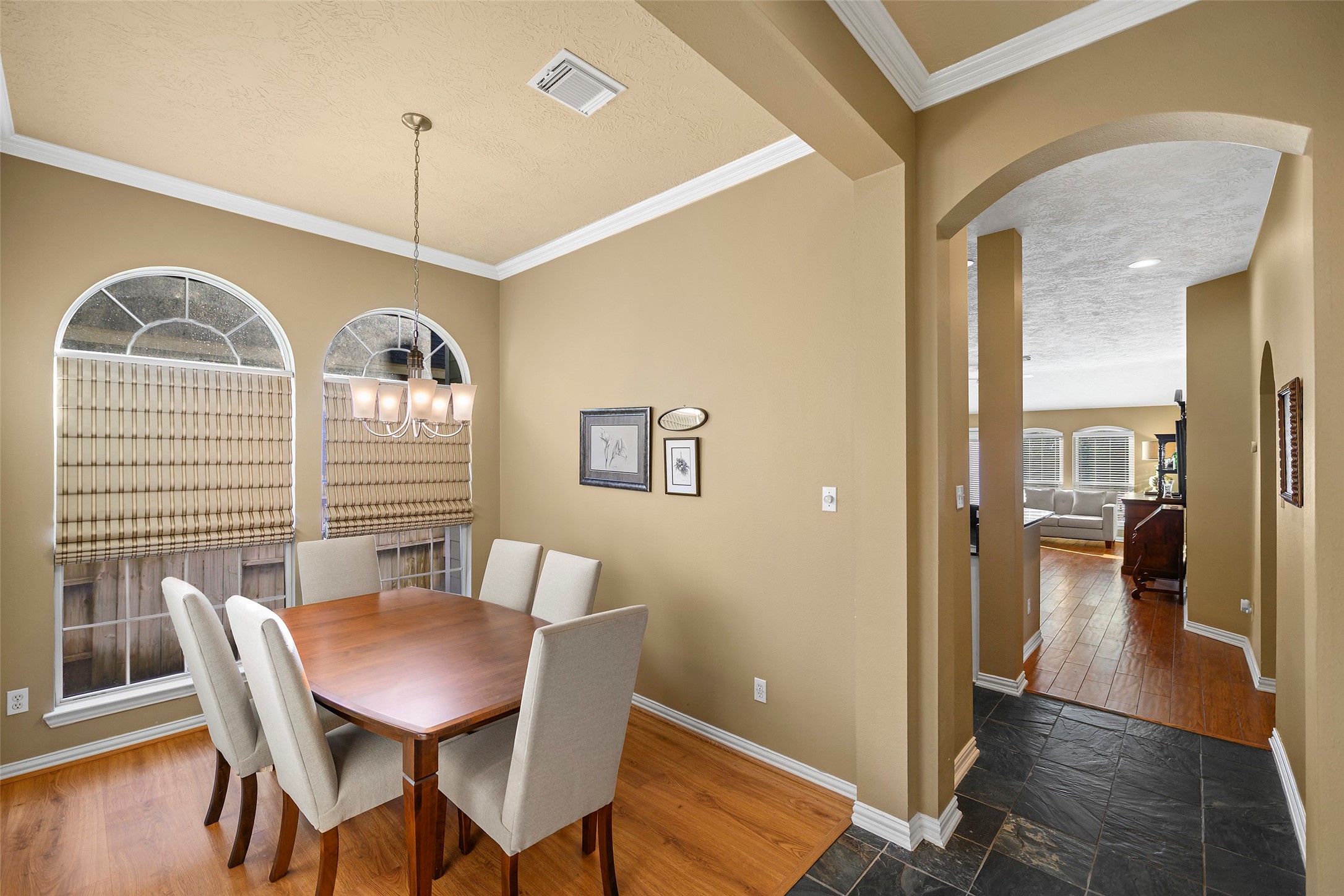 As you walk further into the home you are greeted by the formal dining room.