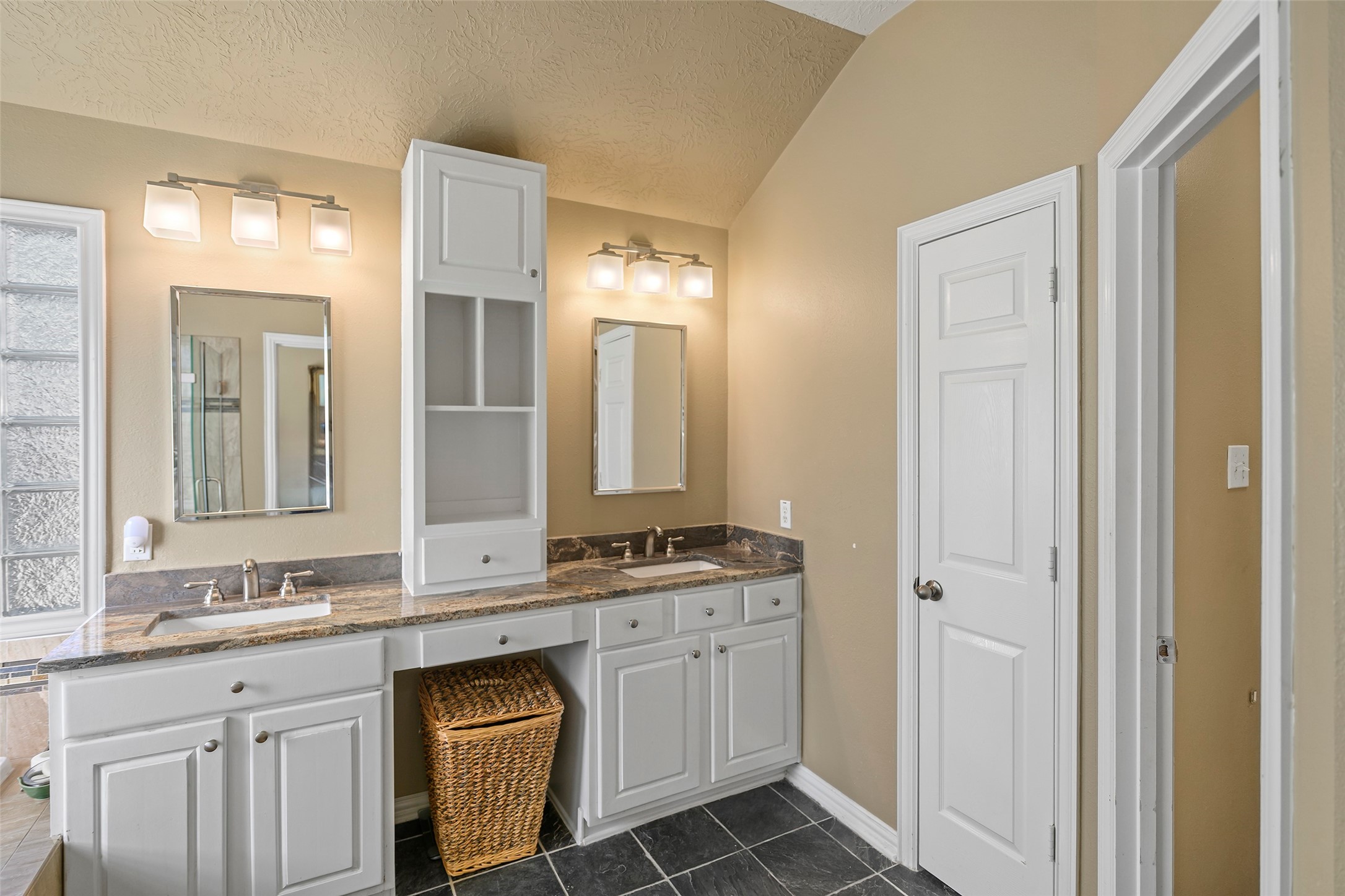 Double Vanity and plenty of cabinet space.