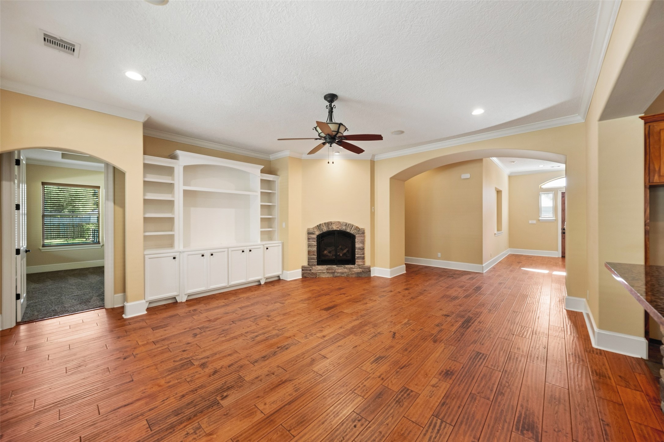 Family room also features built in and gas log fireplace