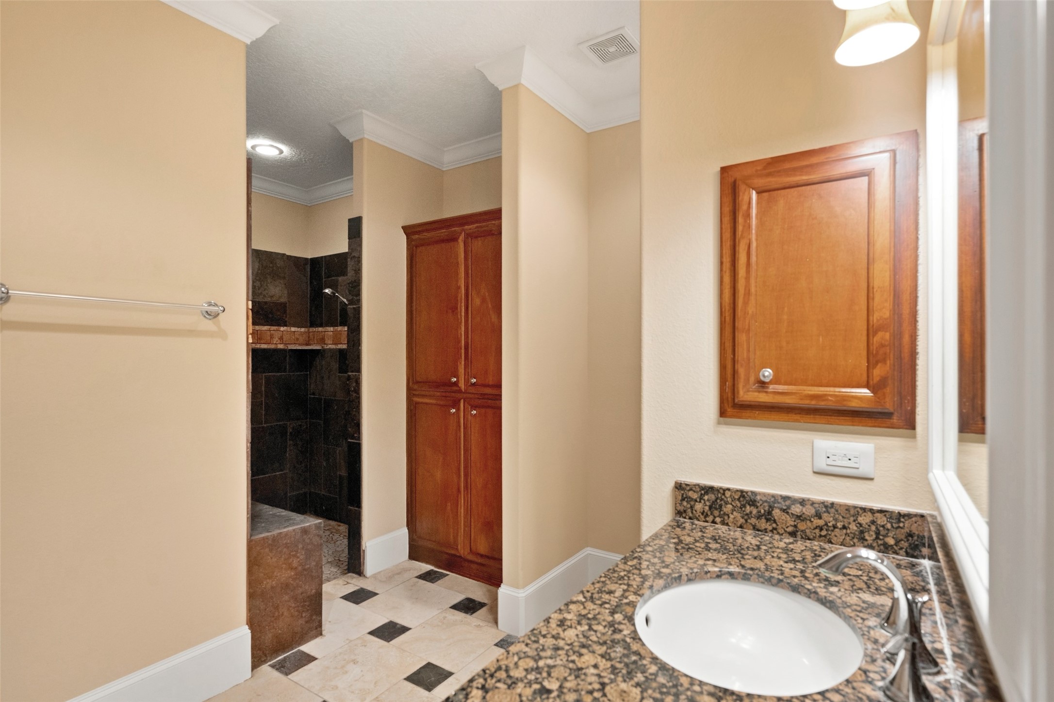 The guest house offers a full bath with a convenient roll-in shower, ideal for accessibility needs.