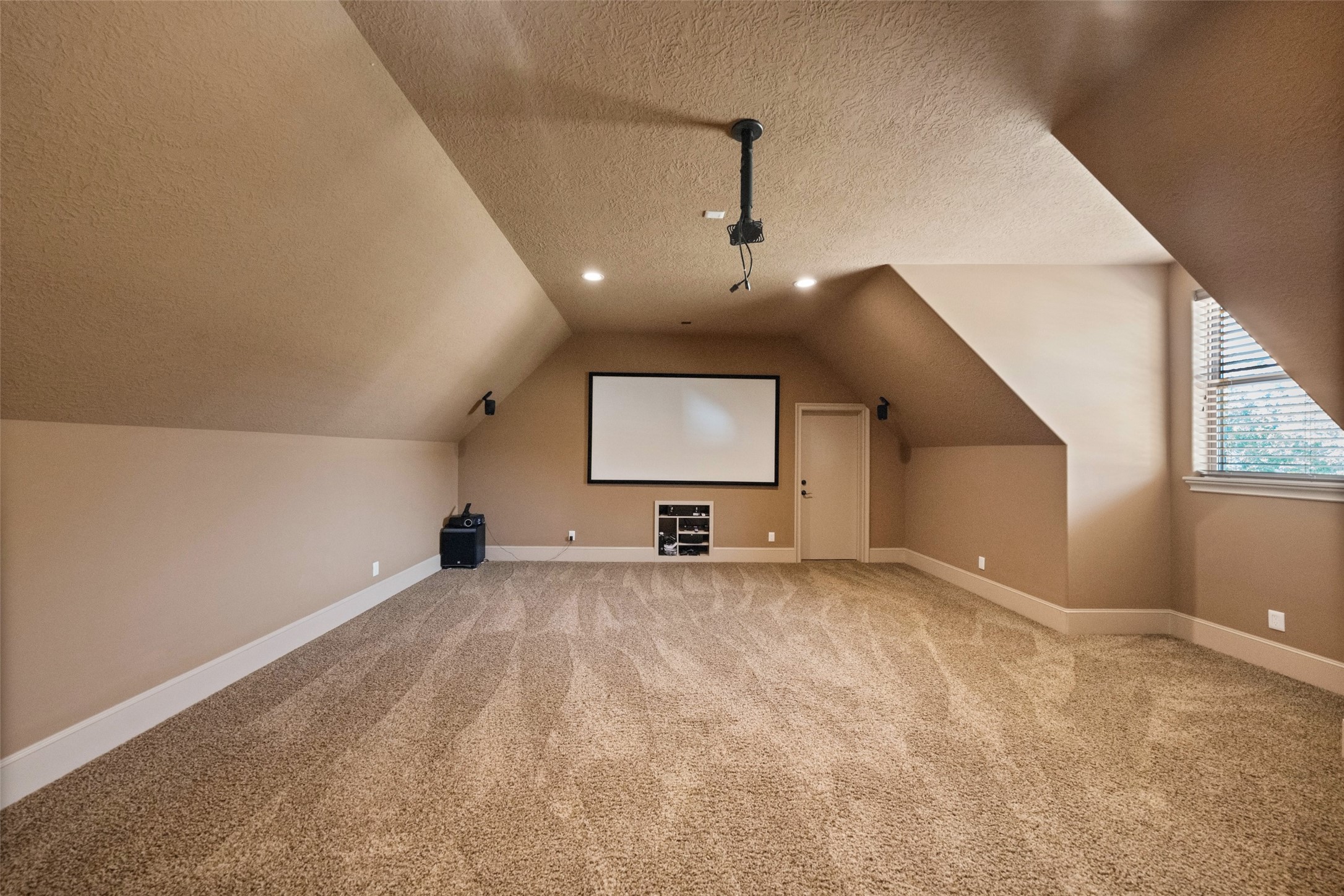 Expansive private media room perfect for oversized furniture and ultimate entertainment.