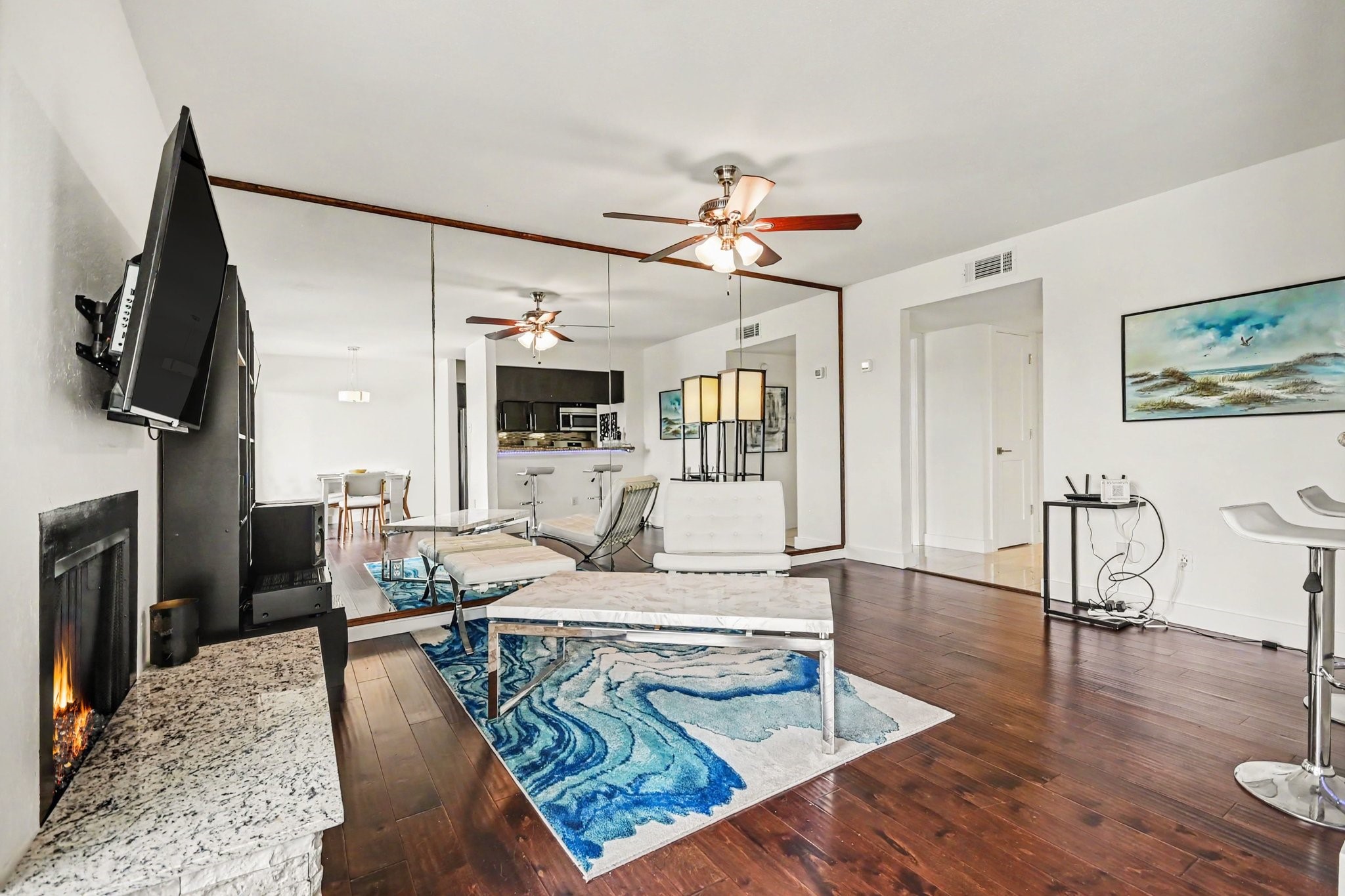 Open living area with fireplace and breakfast bar