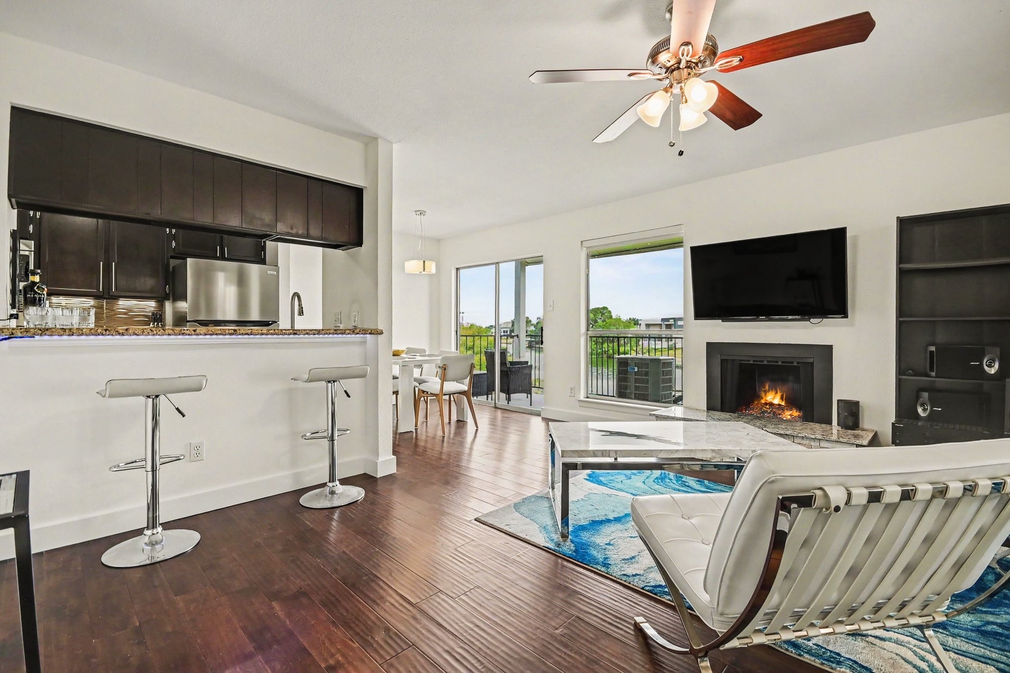 Living room with fireplace and kitchen connection