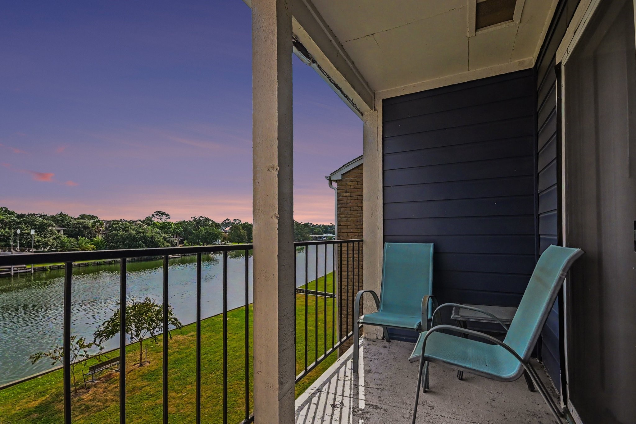Twilight waterfront view from the covered balcony