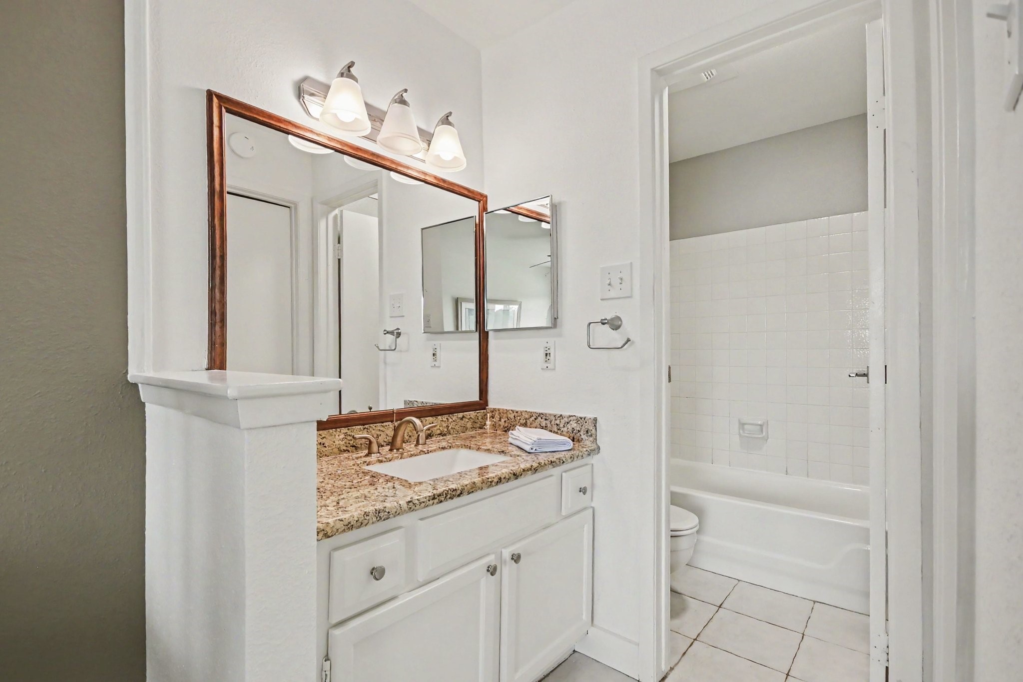 Primary bath vanity with granite countertop