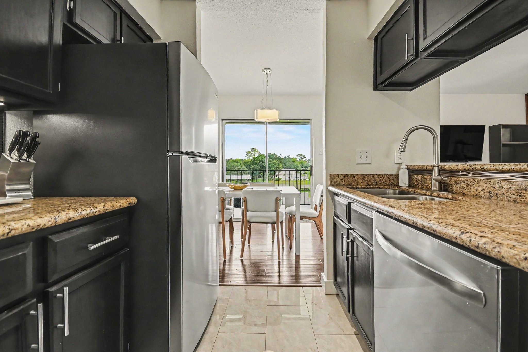 Kitchen with granite counters and stainless appliances
