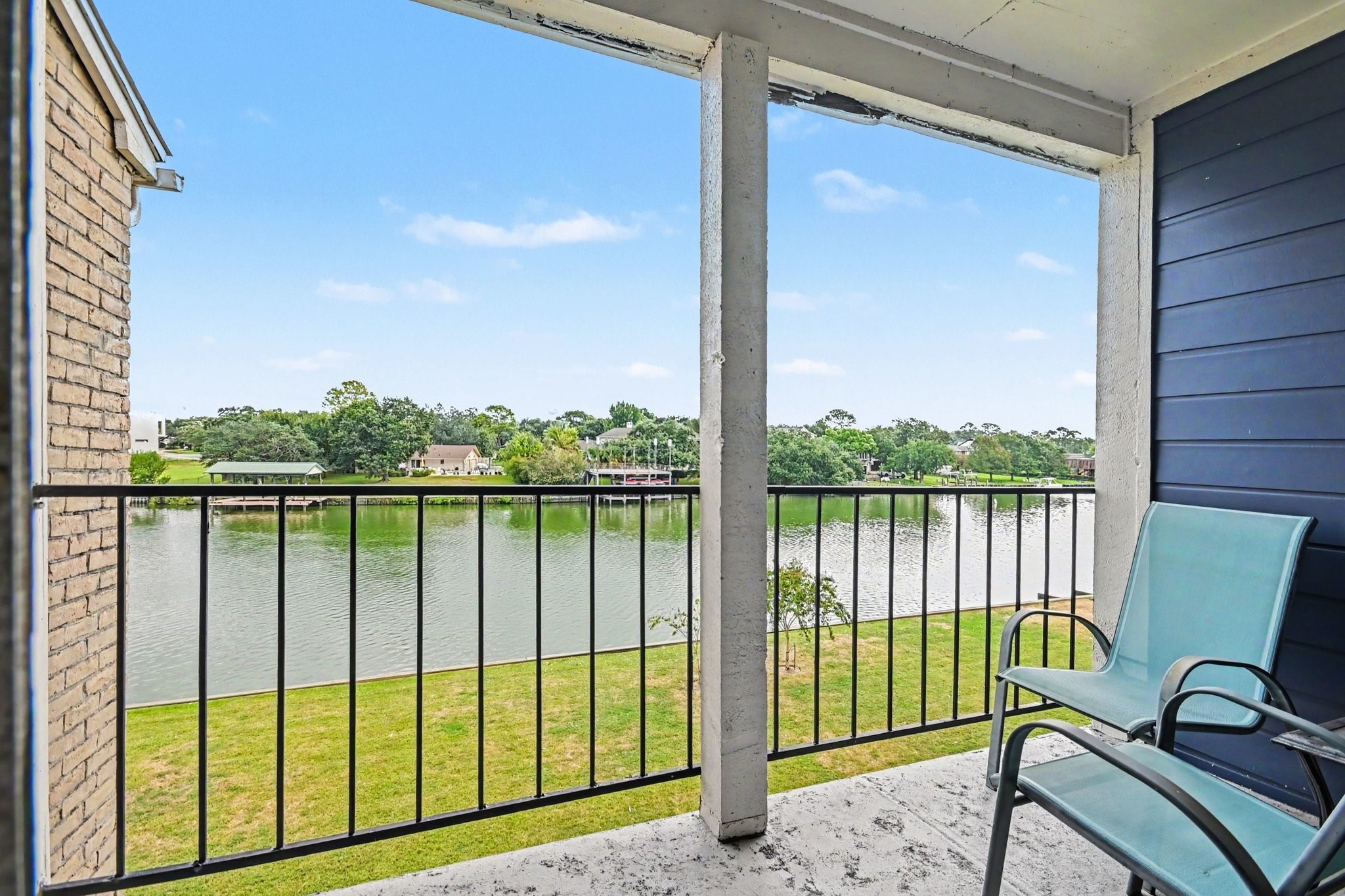 Covered Balcony with seating and expansive water views