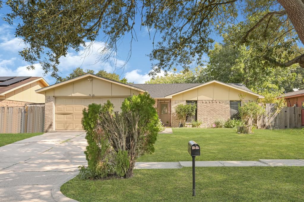 Charming single-story home with a brick facade, well-maintained lawn, and mature trees providing shade and curb appeal. Charming single-story home with a brick facade, well-maintained lawn, and mature trees providing shade and curb appeal.