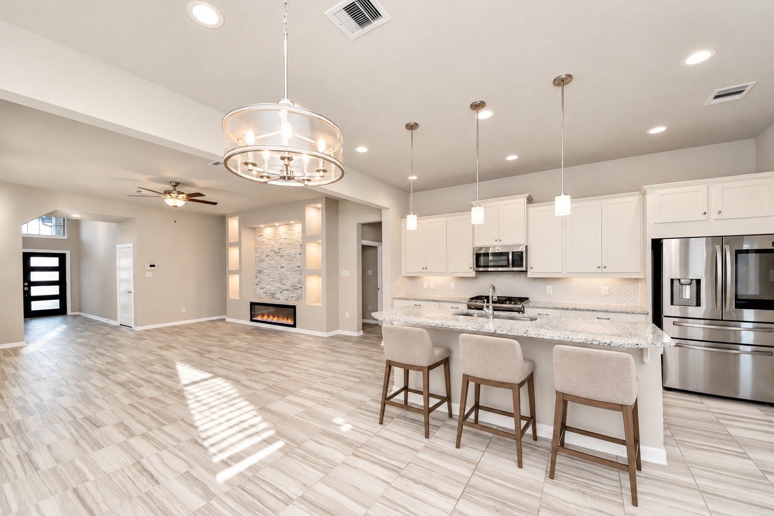Spacious open concept layout seamlessly connecting the kitchen, dining area, and living room.