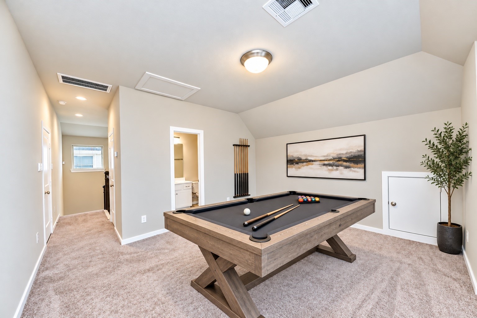 Versatile upstairs game room offering additional space for entertainment, recreation, or relaxation.