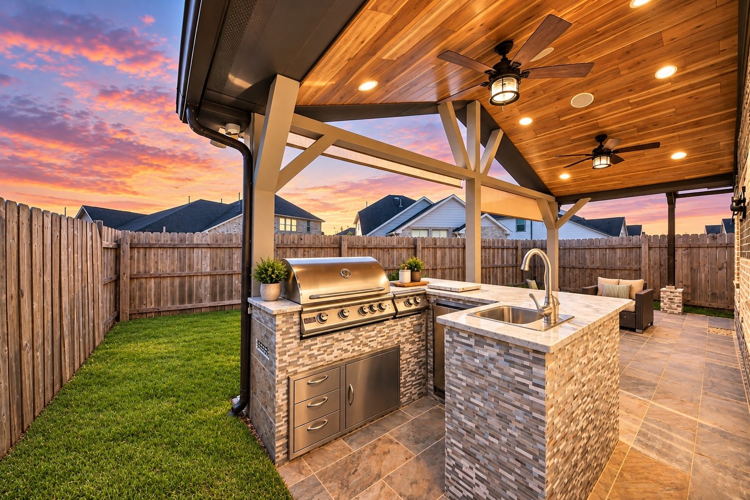 Impressive outdoor kitchen featuring built-in cooking amenities and a covered entertaining area.