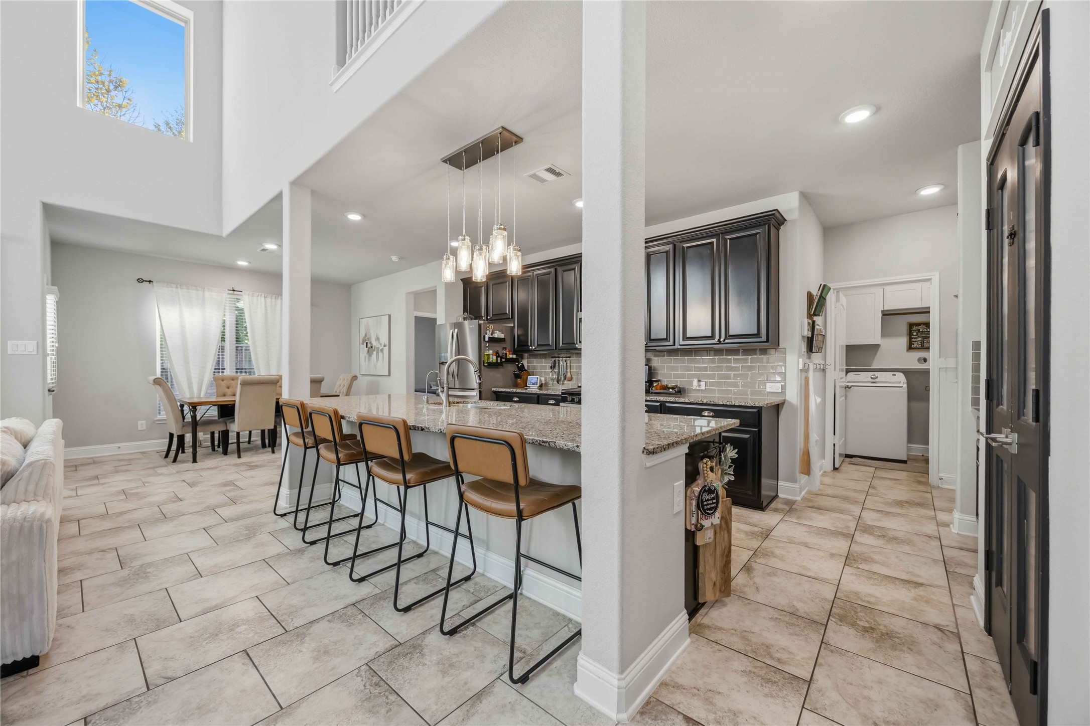 Pull up a stool at the island, with seating for four looking out over the dining area.
