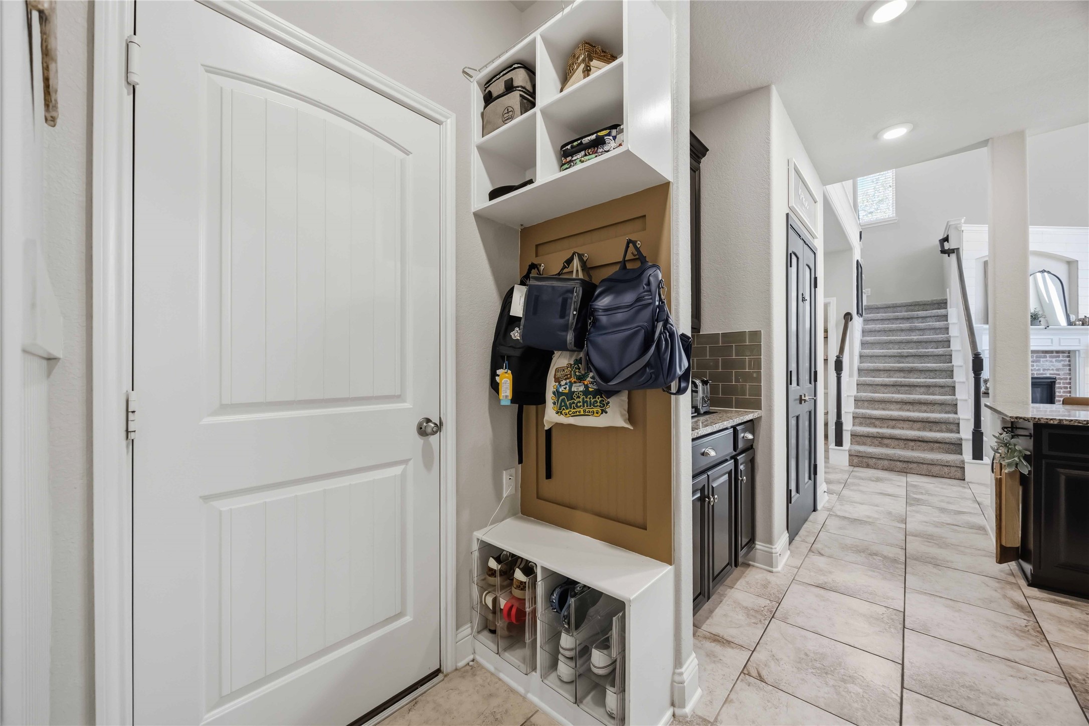 A drop zone right off the entry gives backpacks, keys, and shoes a home of their own.