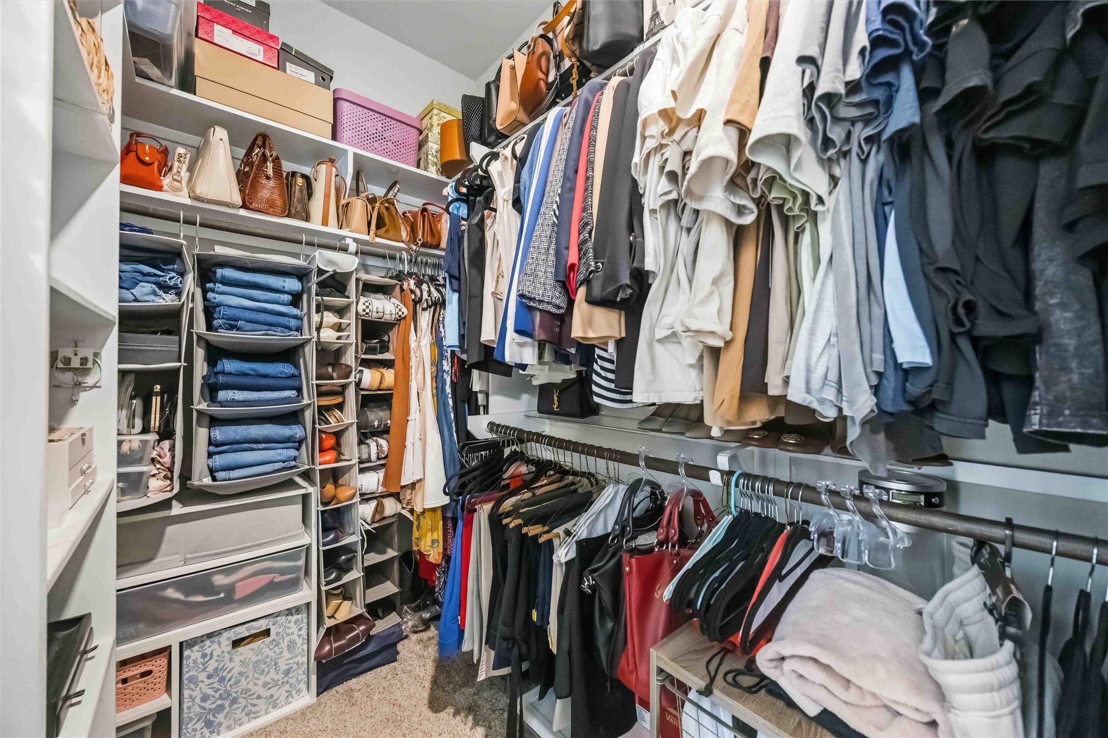 The walk-in closet offers built-in shelving and generous hanging space for every season.