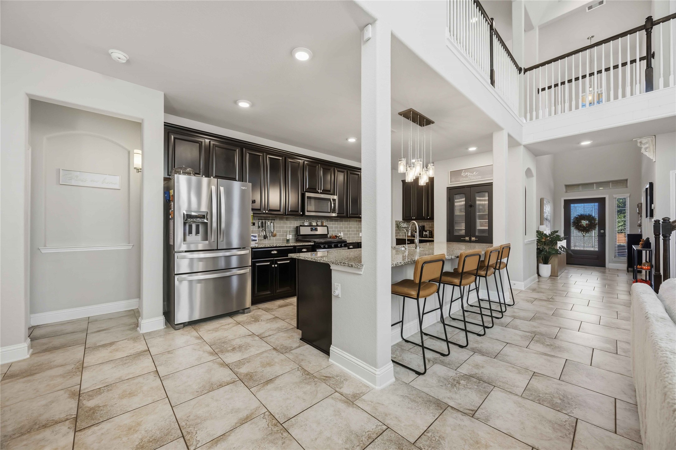 Gleaming stainless appliances and a breakfast bar make the kitchen easy to love from day one.