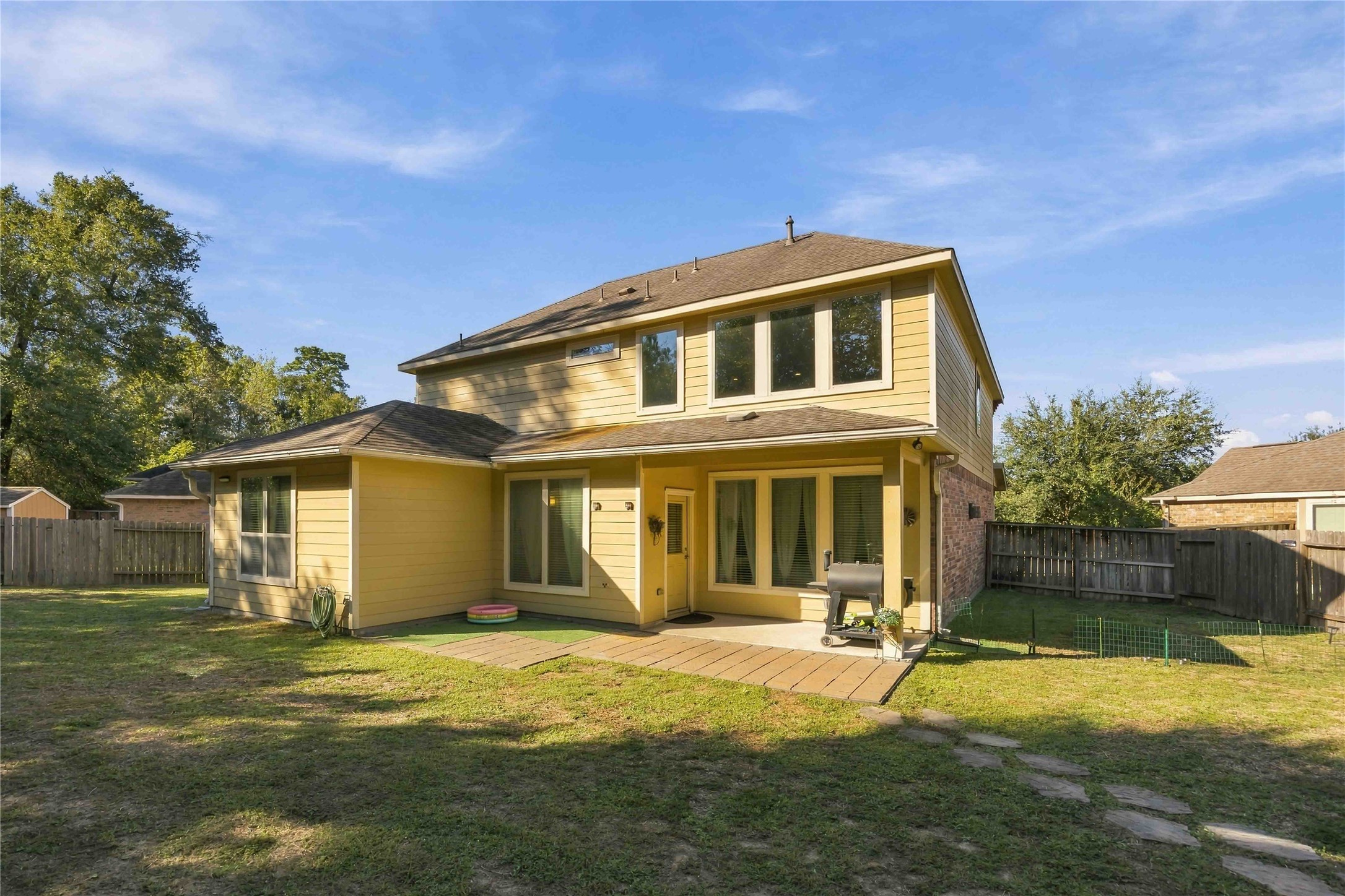 Out back, a covered patio extends your living space into the fresh air.