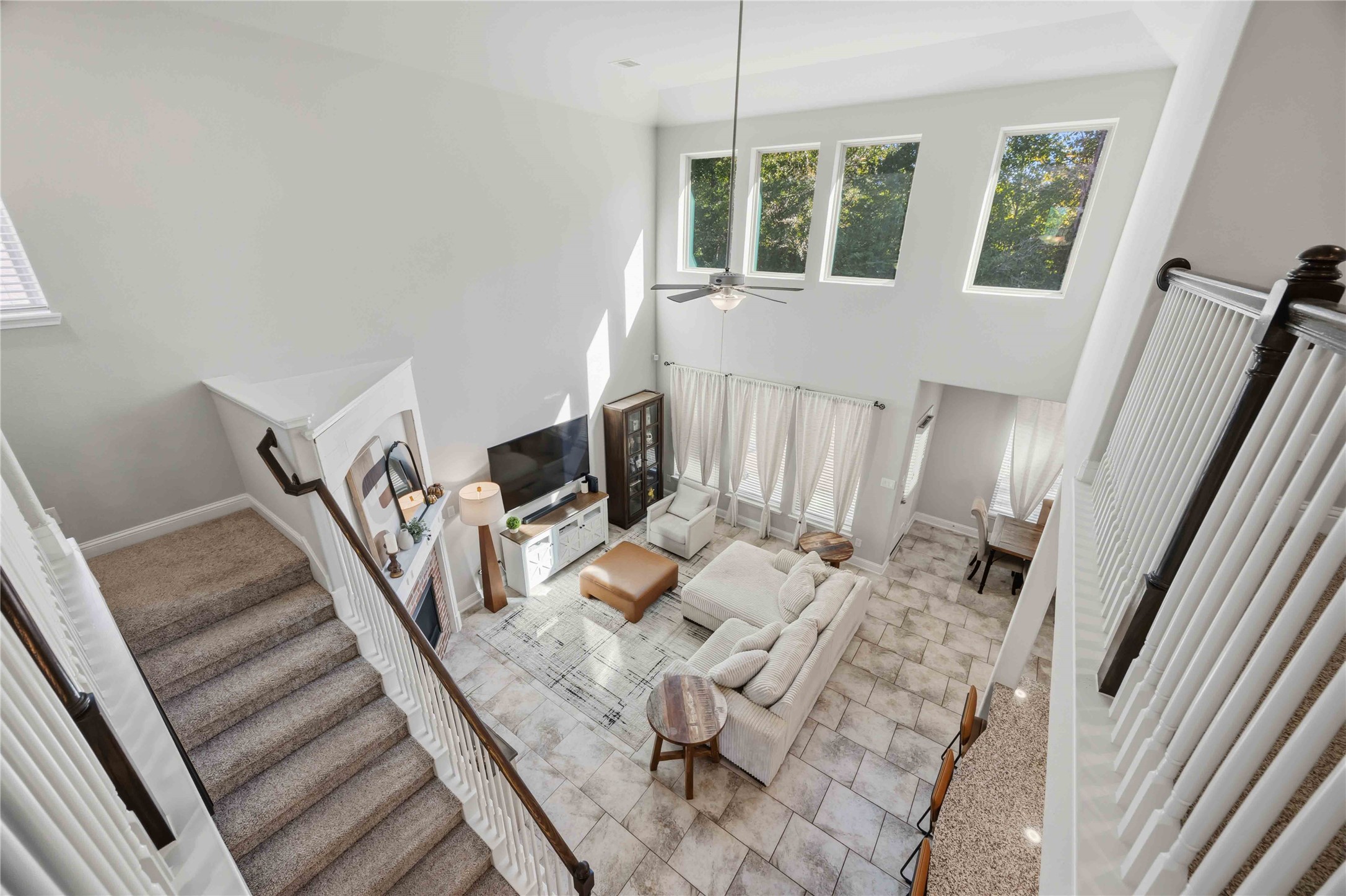 Look down from the overlook to see just how open and airy the living room feels.