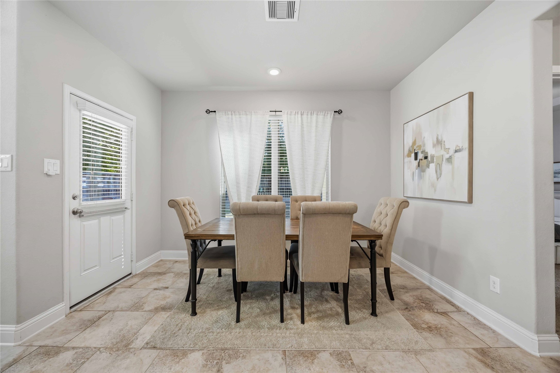 Natural light fills the dining room, ready for everything from Sunday brunch to holiday dinners.