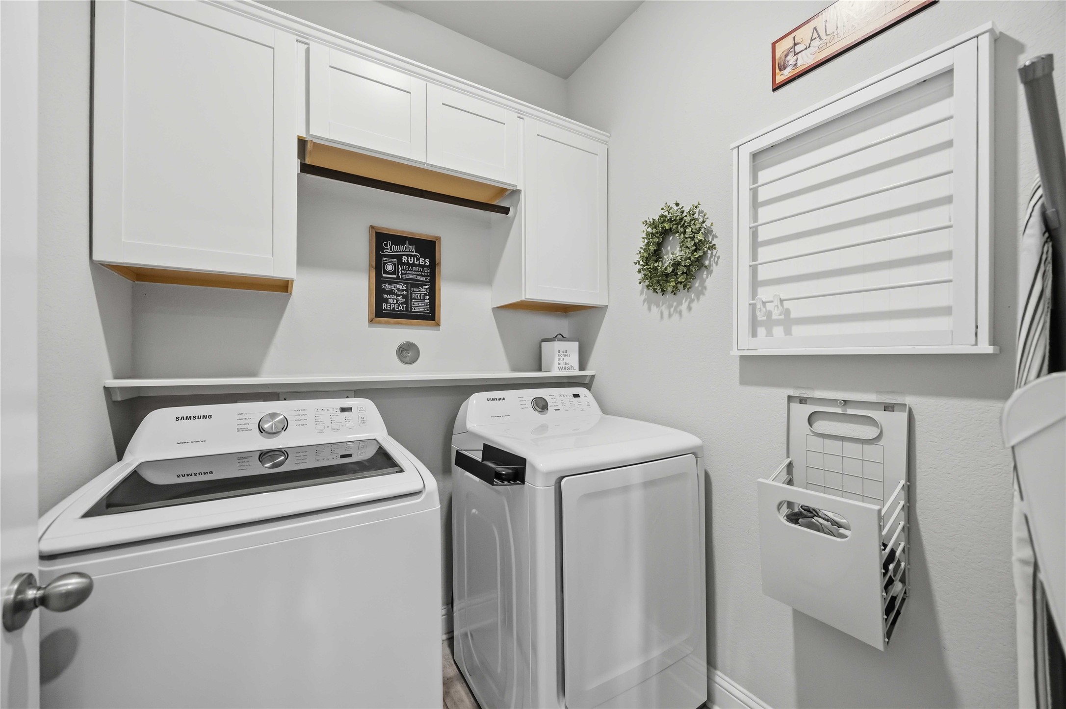 Built-in cabinetry keeps the utility room organized and laundry day simple.