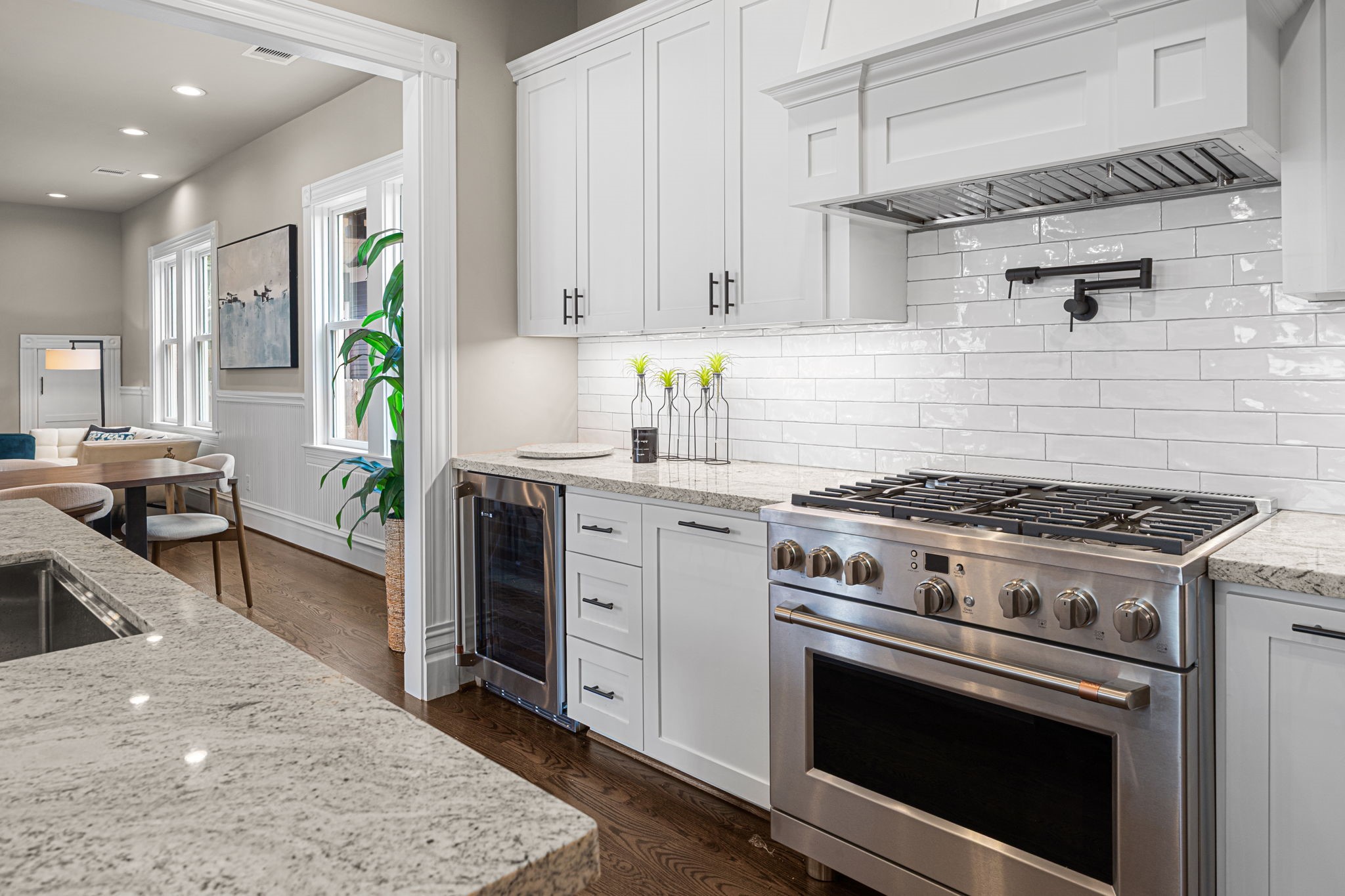 Granite countertops, tile backsplash, all site-built custom wood cabinetry with soft close hinges.