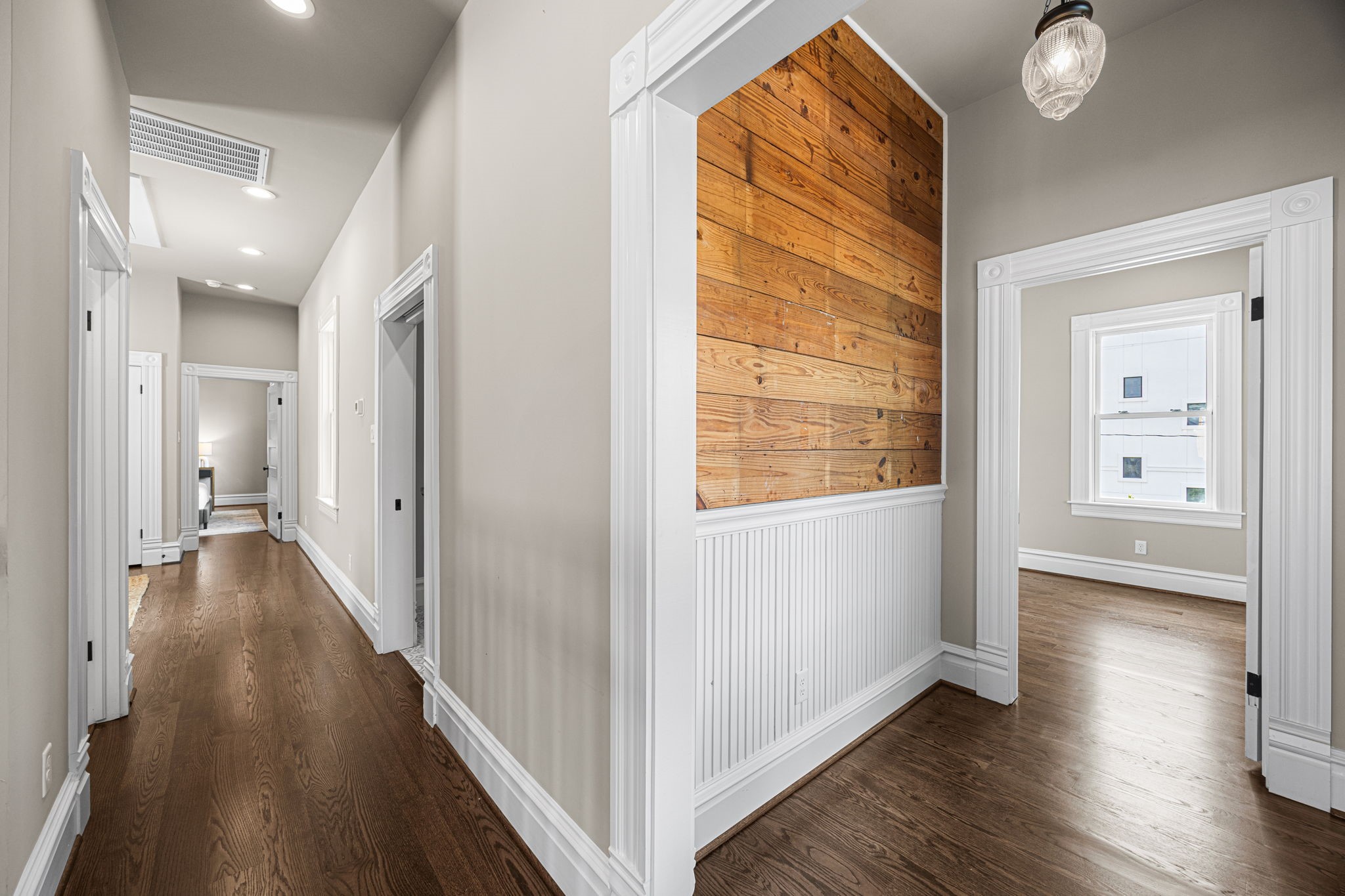 2nd floor hallway/stairwell landing. Upstairs you will find 3 bedrooms, a 2nd living room, nice size balcony and laundry room.