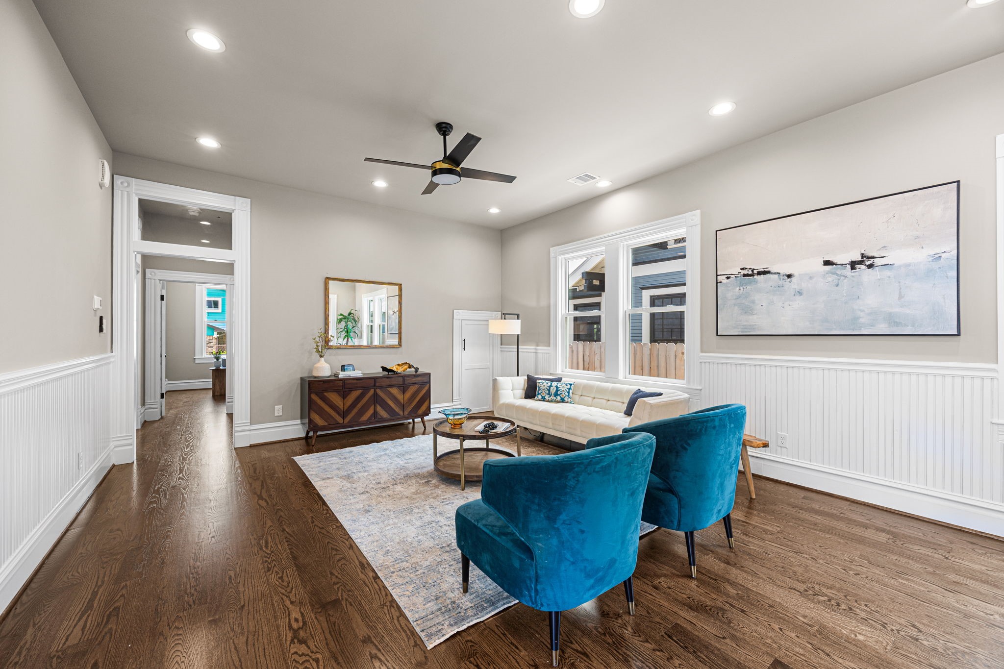 The 1st floor living anchors this space and welcomes guests from the entry foyer.