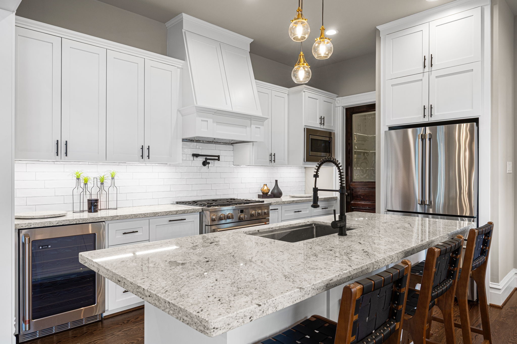 The chef in the family will enjoy the abundant amount of countertop space, stainless steel appliances with commercial grade stove, beverage fridge...and more.