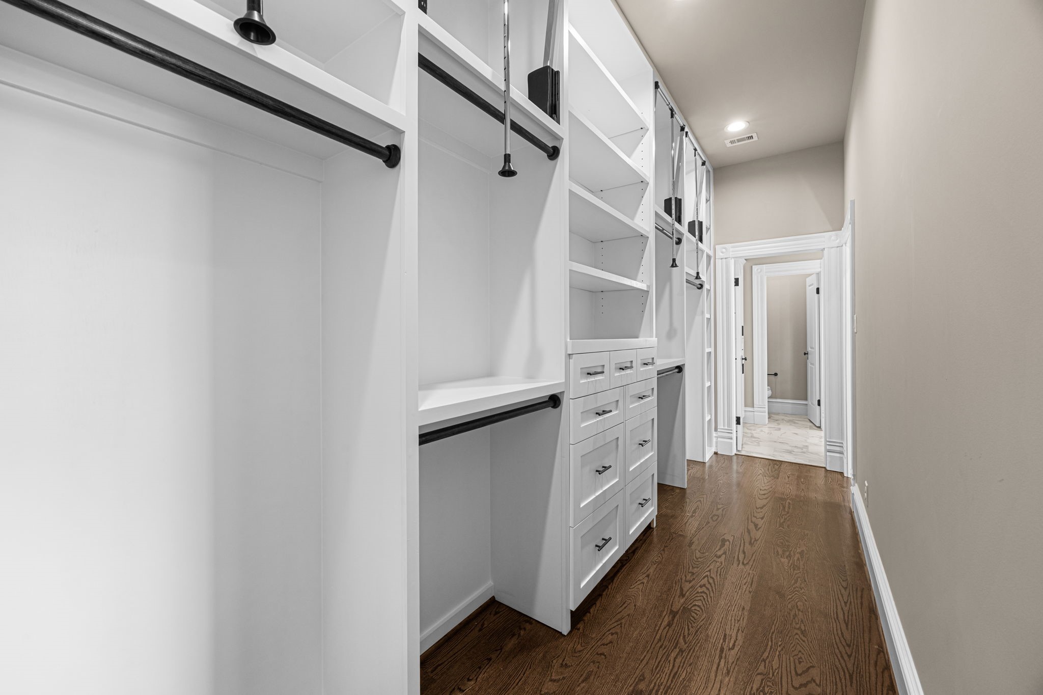 The primary closet offers floor to ceiling built-ins with endless organizing options!