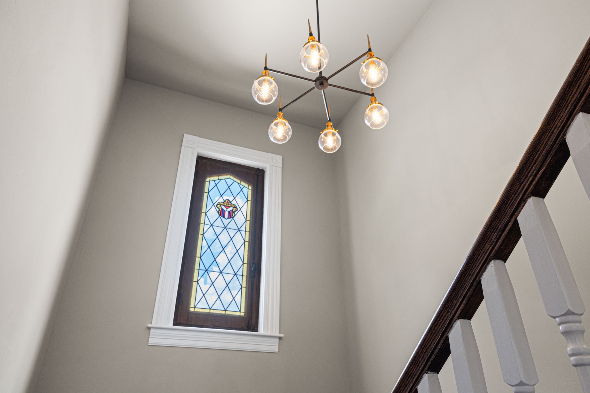 Notice the vintage reclaimed stainless glass window in the stairwell - your dose of classic charm in a modern, new construction build.