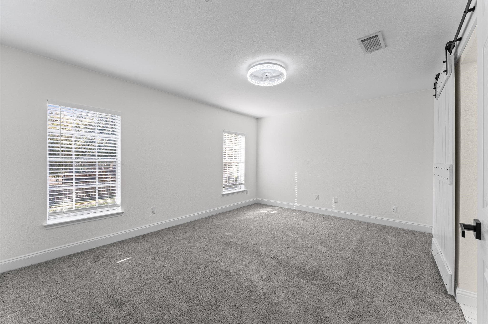 The Primary Bedroom is located on the second floor and features two windows that bring in natural light.