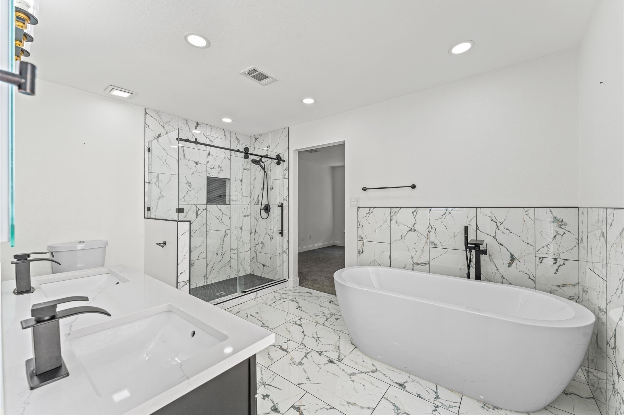 Spacious Primary Bath features double sinks, a freestanding soaking tub, and a separate walk-in shower. Spacious Primary Bath features double sinks, a freestanding soaking tub, and a separate walk-in shower.