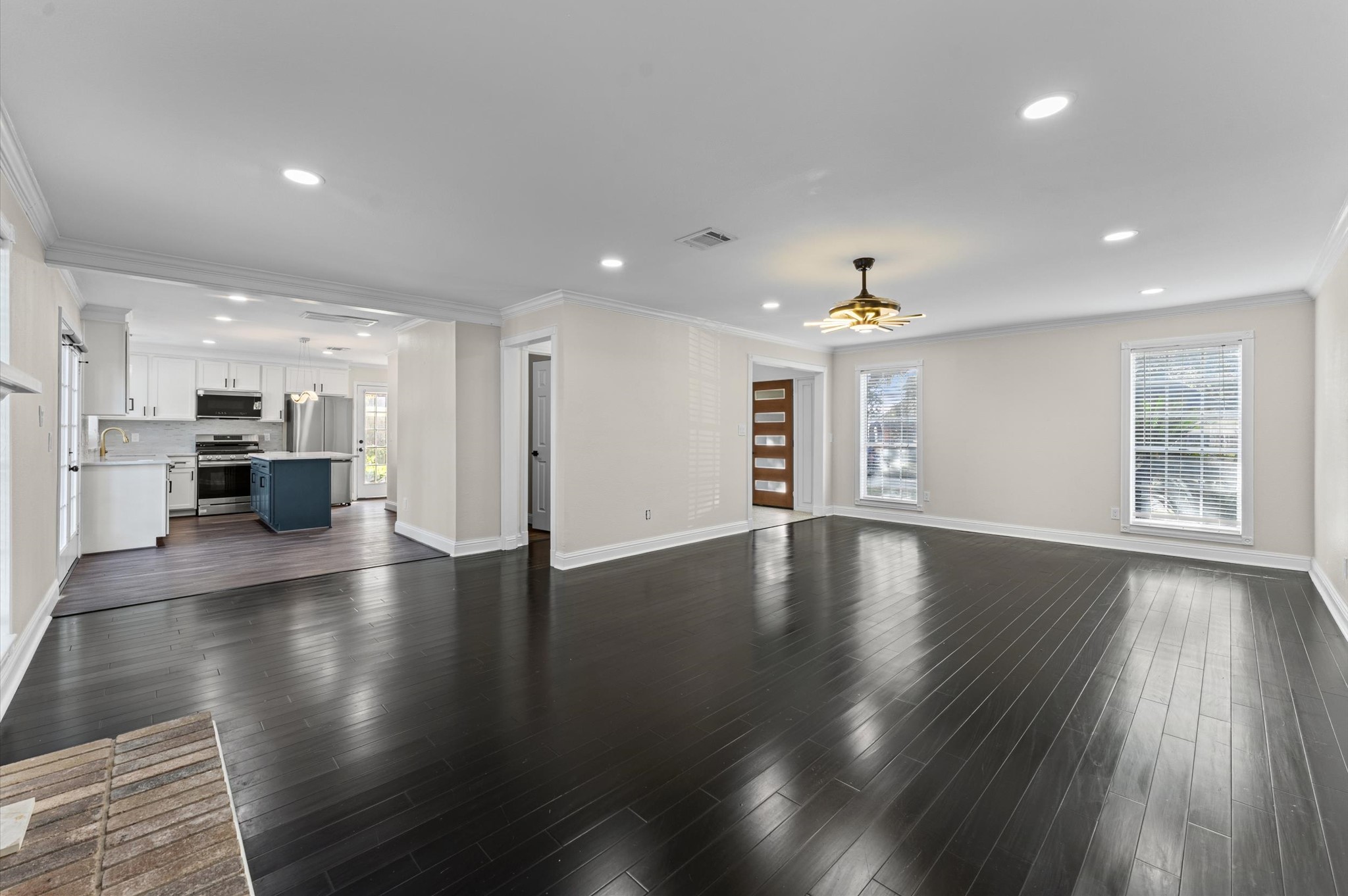 The first-floor Living Room opens to the kitchen and Breakfast Room for an easy flow between the main living spaces.