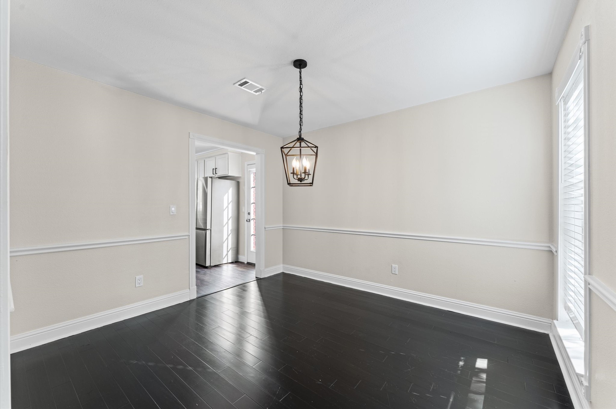 The formal Dining Room is located beside the entry, with direct access to the kitchen.