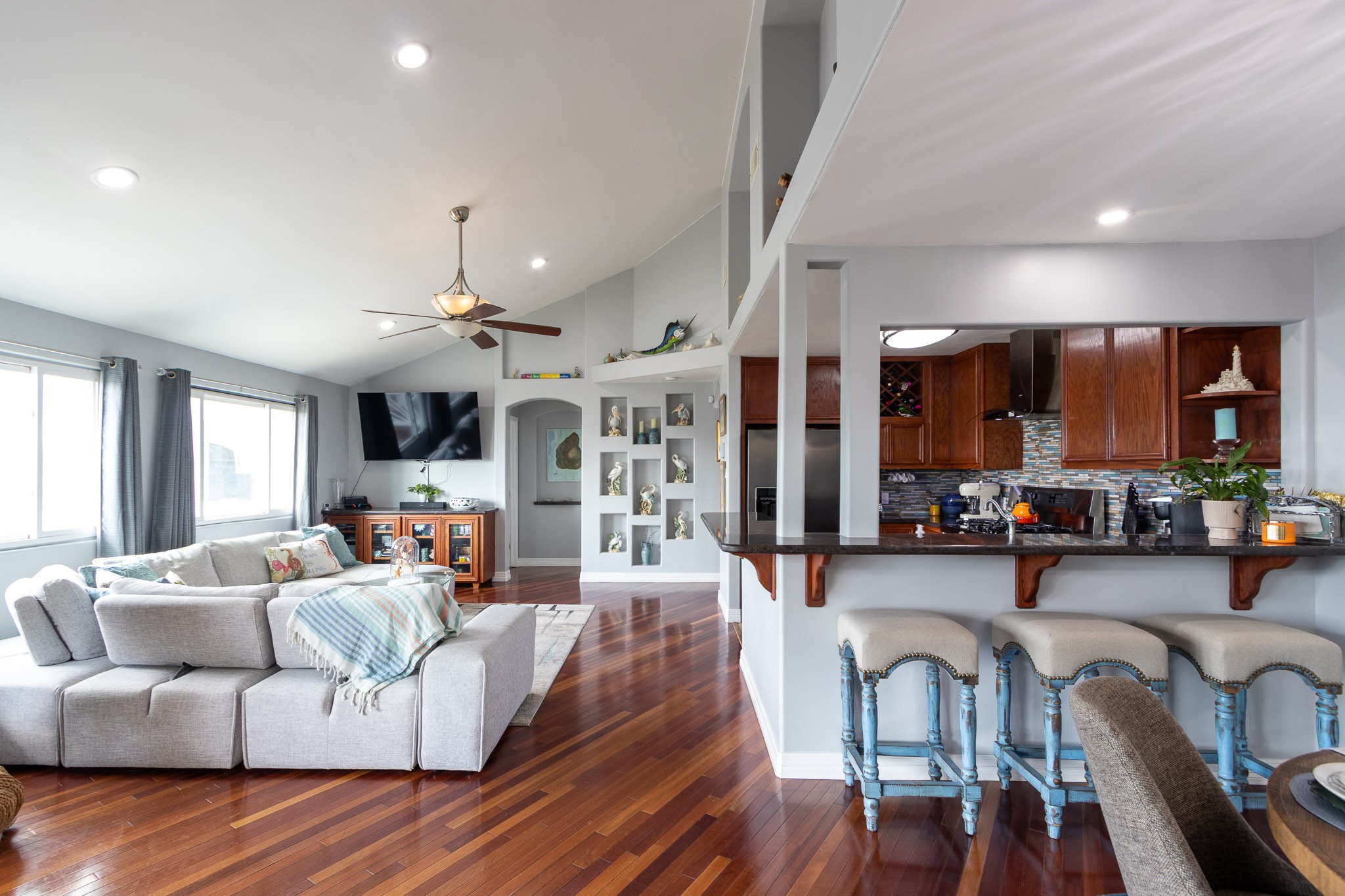 Spacious living room, bay view from the big picture windows  Brazilian Hardwood Cherry floors.  Breakfast bar.