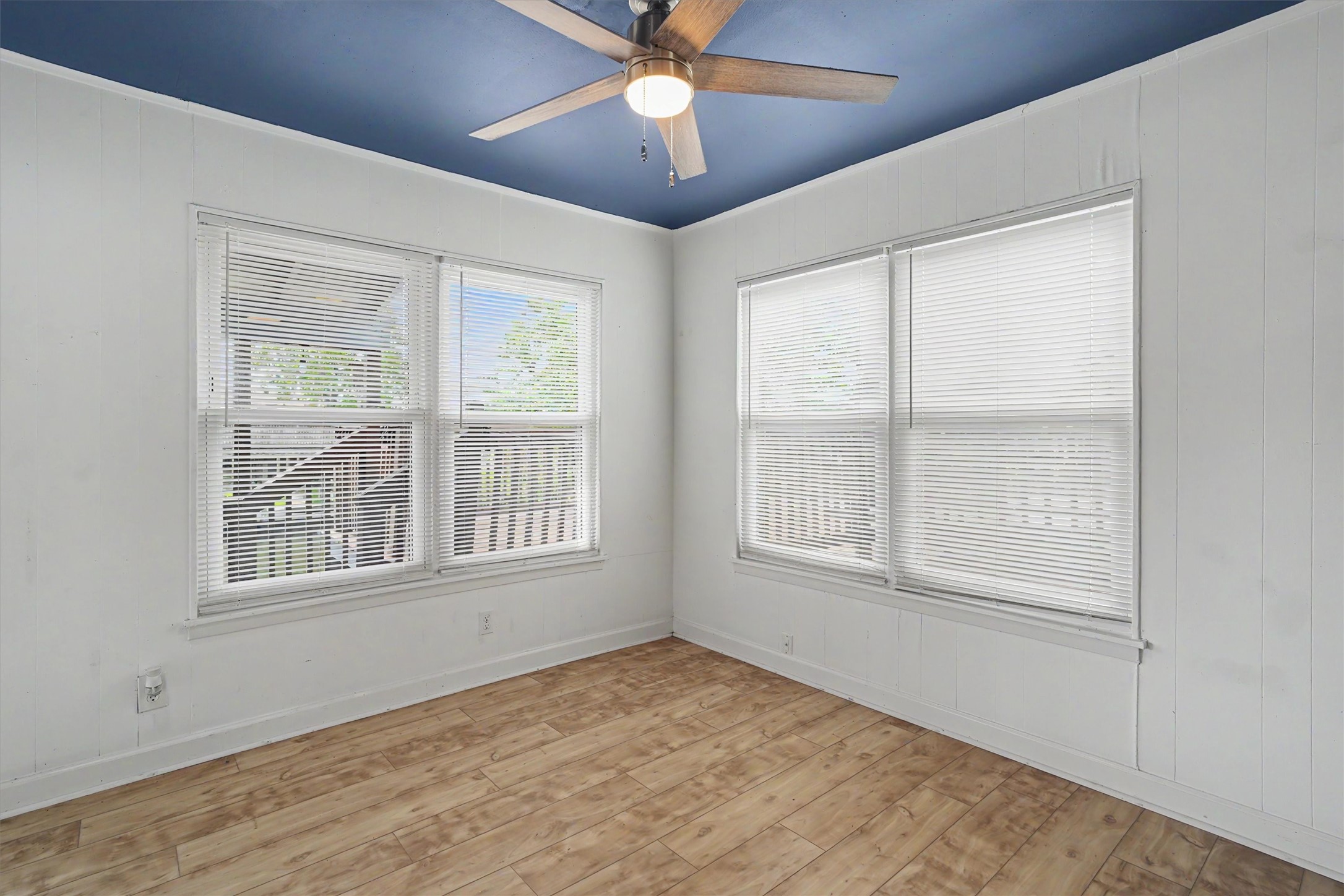 Front corner of home overlooking the upper party deck in the side yard
