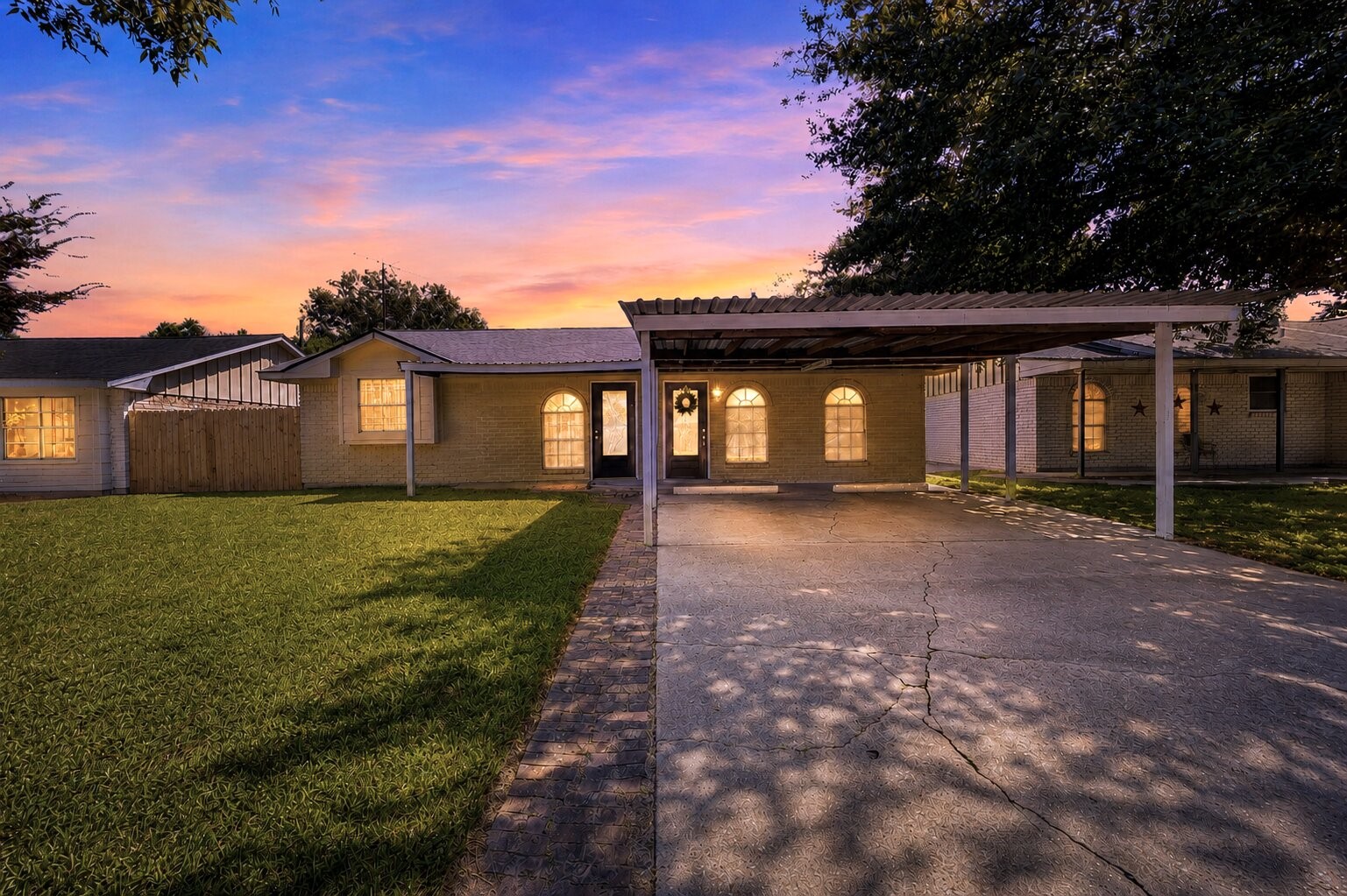 Welcoming exterior with a charming evening glow and inviting curb appeal.