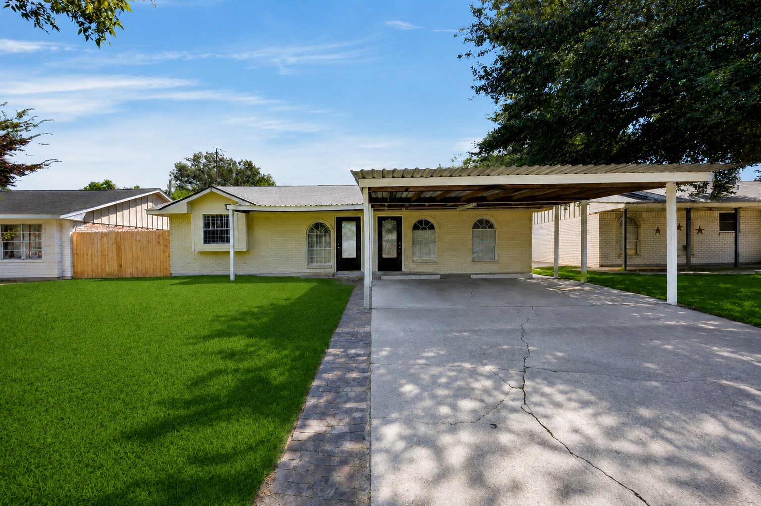 Classic front elevation with a welcoming walkway and mature landscaping.