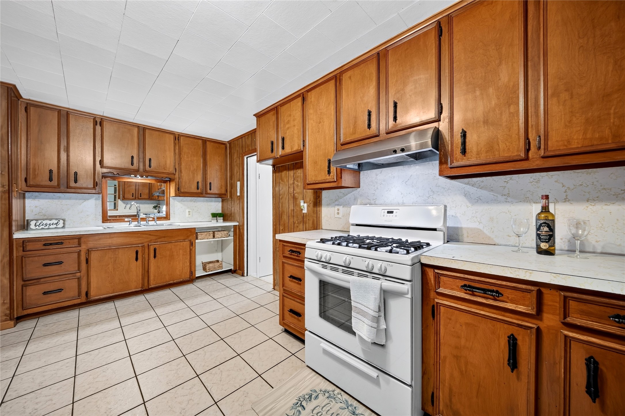 Warm wood cabinetry brings timeless character to the kitchen.