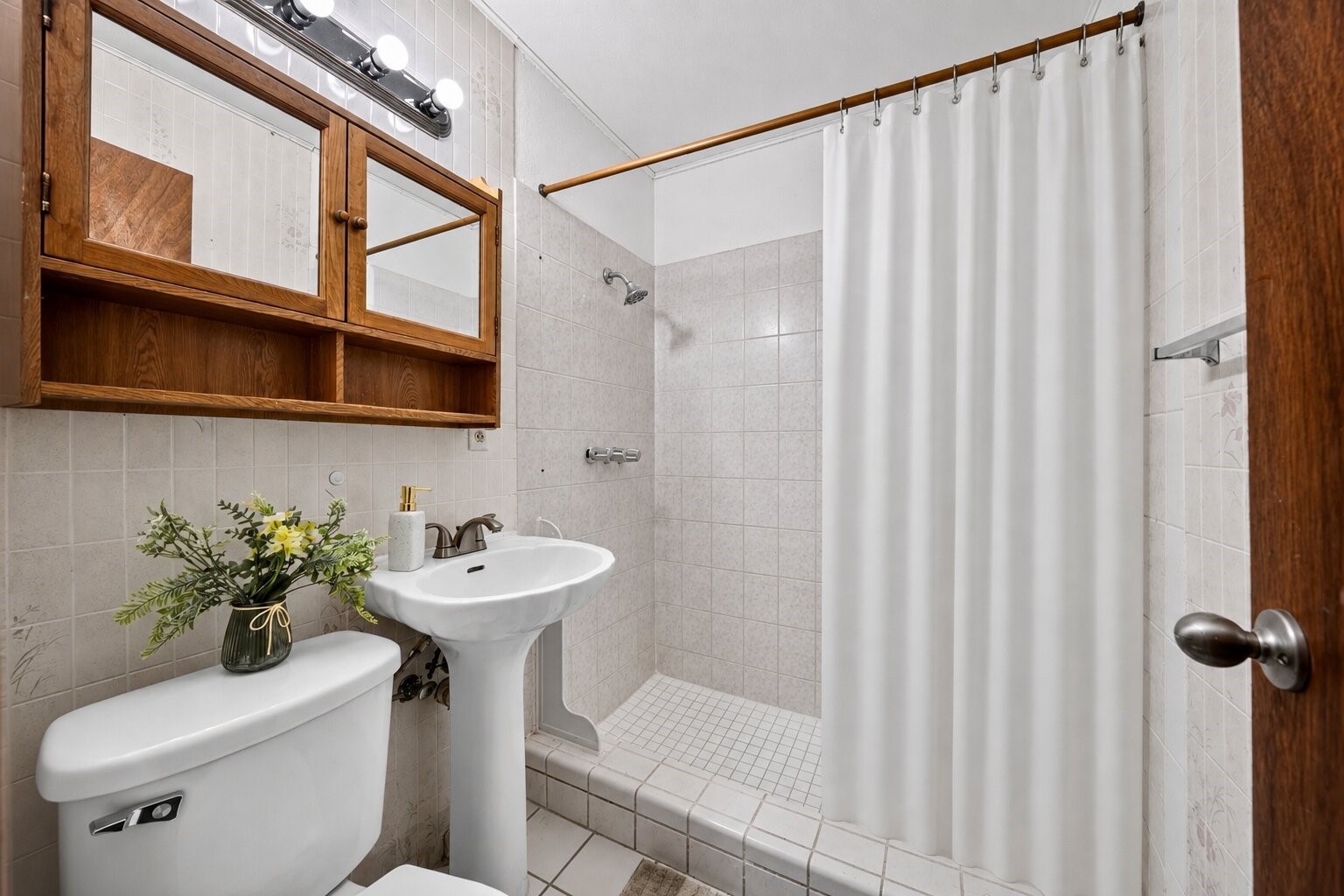 Clean and functional bath with classic finishes.