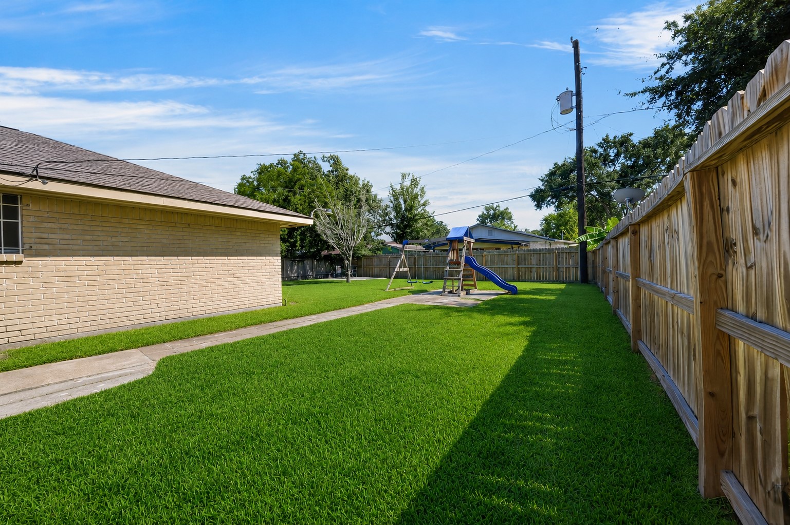 Large fenced yard offering privacy and space to play.