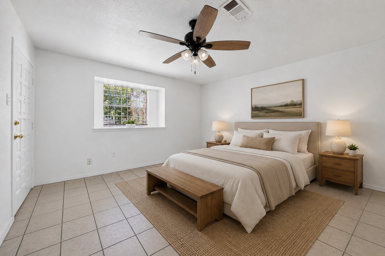 Serene bedroom retreat with soft natural light and neutral tones.