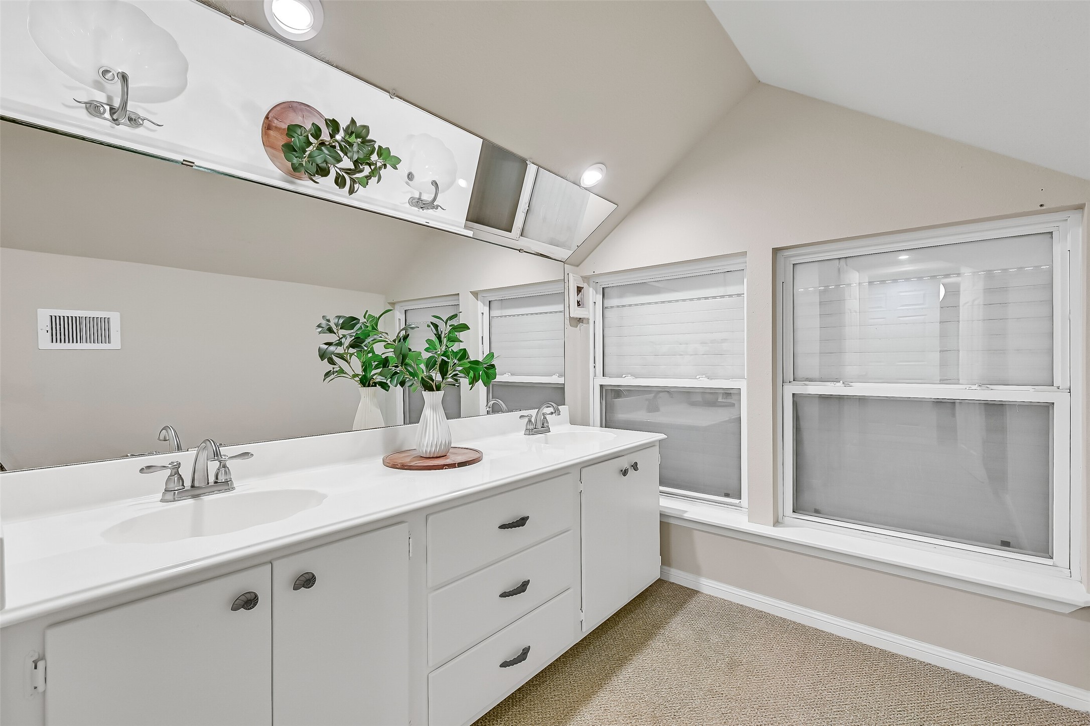 A full bathroom serves the third-floor living spaces, providing convenient accommodations for guests utilizing the upstairs flex rooms. Neutral finishes and a tub/shower combination offer both comfort and functionality.