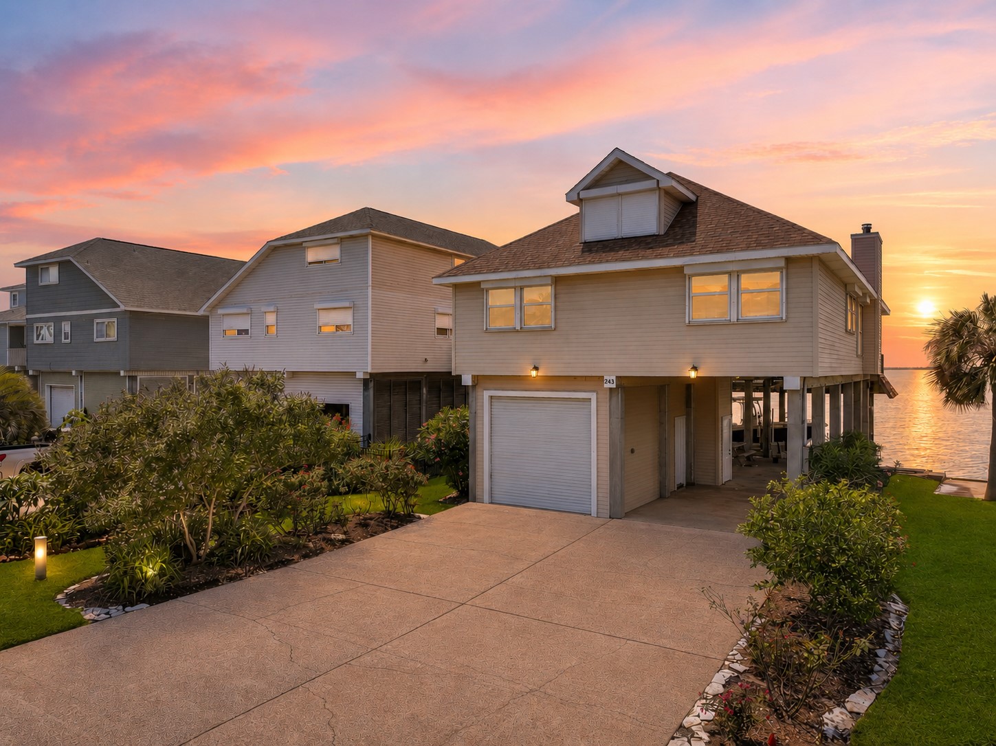Welcome to 243 Isle End, a spectacular bayfront residence on highly desirable Tiki Island. Manicured landscaping, an oversized driveway, covered parking, and a one-car garage create a warm first impression, while panoramic water views and unforgettable sunsets hint at the lifestyle that awaits.